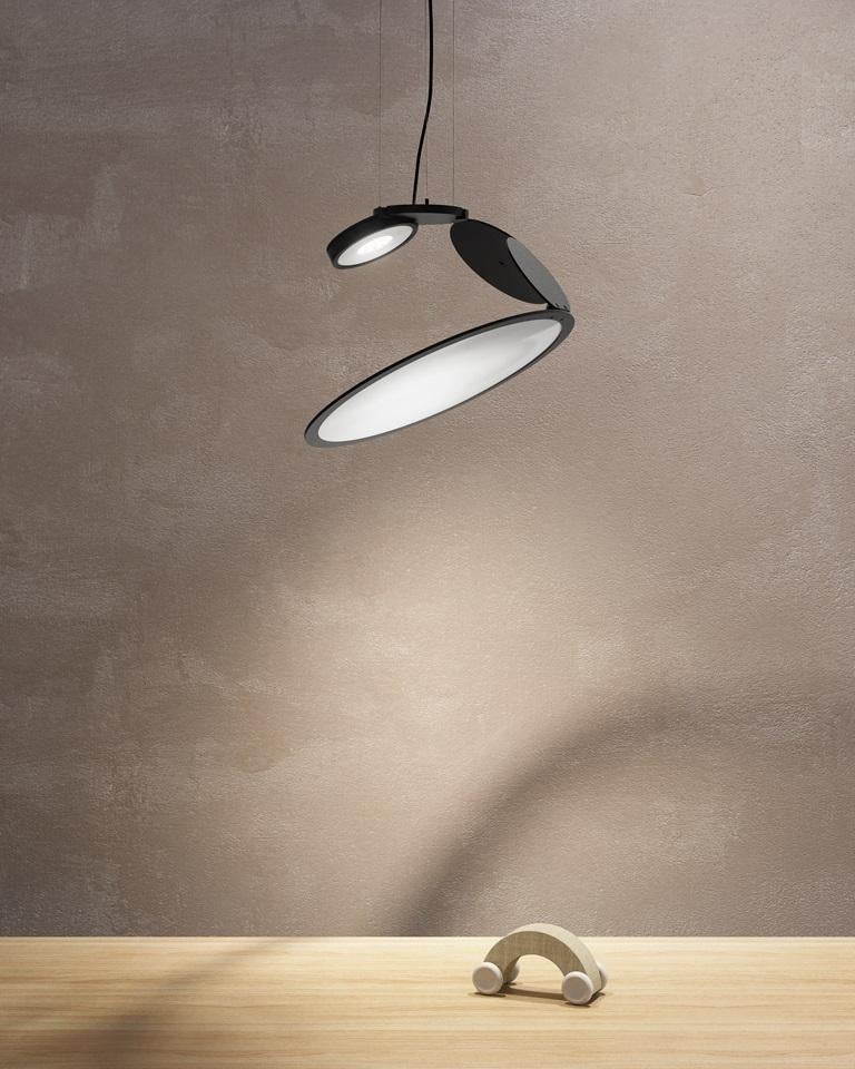 Axolight Cut Medium Pendant Lamp in Intense Black by Timo Ripatti

Softness of the atmosphere and personalization of orientation. Cut expresses a refined design and an emotional light which does not dazzle, but wraps gently.

Cut is the result of a
