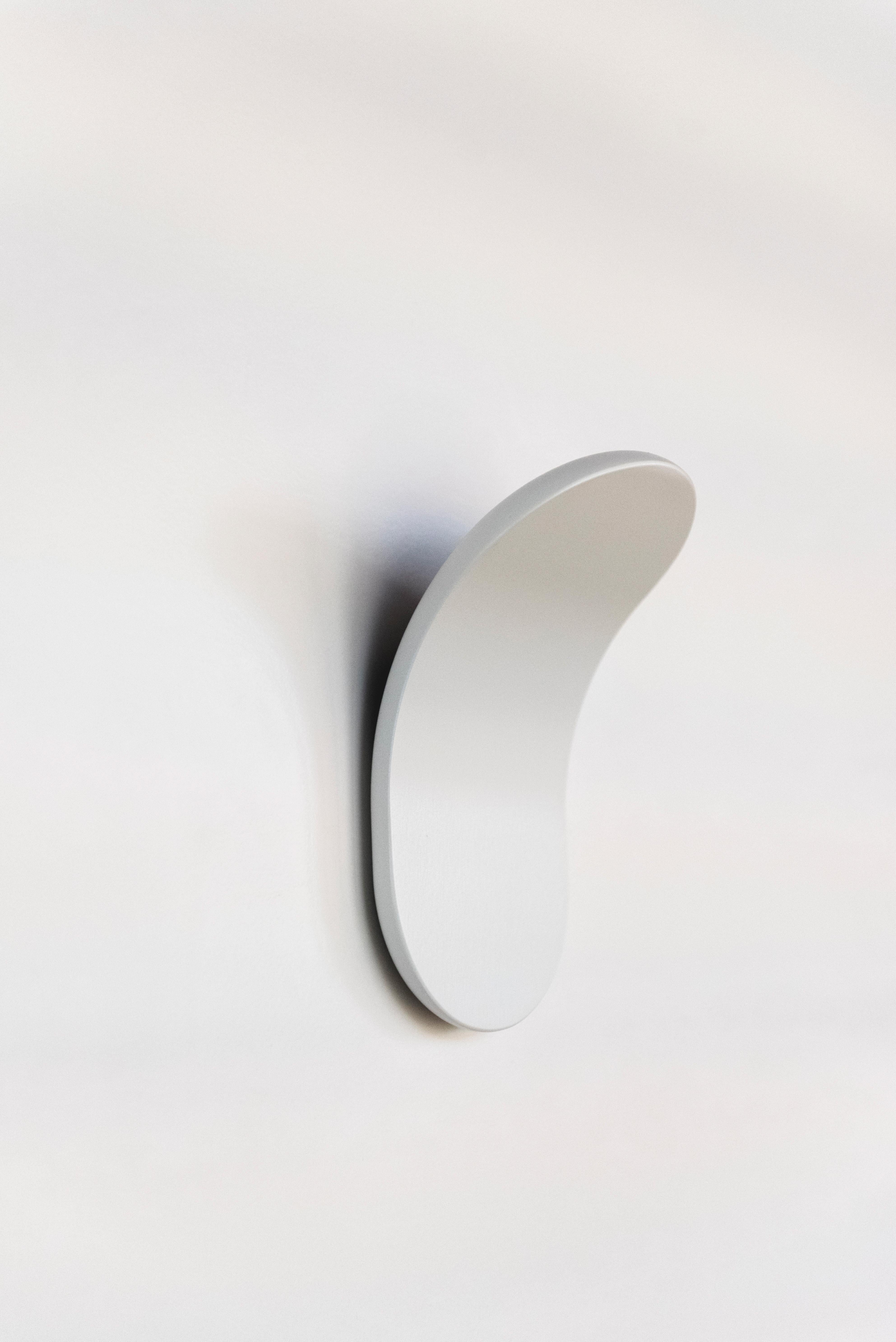 Axolight Lik Wall Lamp in Wrinkled White Aluminum by Serge & Robert Cornelissen

Lik has a soft design and its intense light hidden in the back spreads with harmonious reflections on the wall. Essential simplicity and formal technology are combined