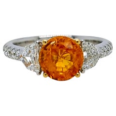 Anillo de oro amarillo y blanco con un granate «Fanta» de 3,25 quilates certificado por AXP y un diamante «Fancy»