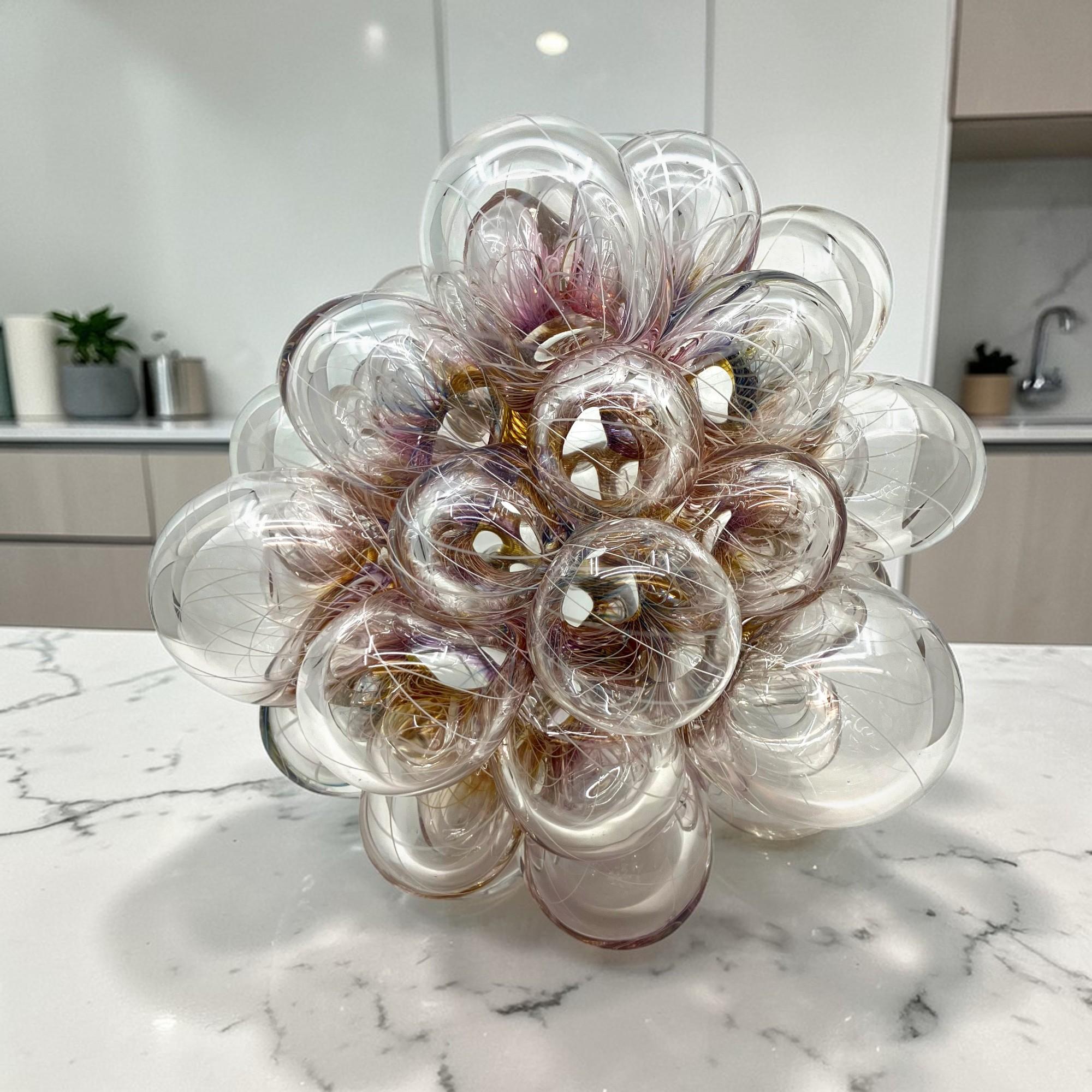 Blown Glass Tabletop Sculpture, Polychromatic Canework, 12 × 12 × 12 in, Aya Oki

Born in Osaka, Japan, Aya Oki is a glass art artist now working in San Bernardino, California. The artist is best known for her blown glass “bouquets:” collections of