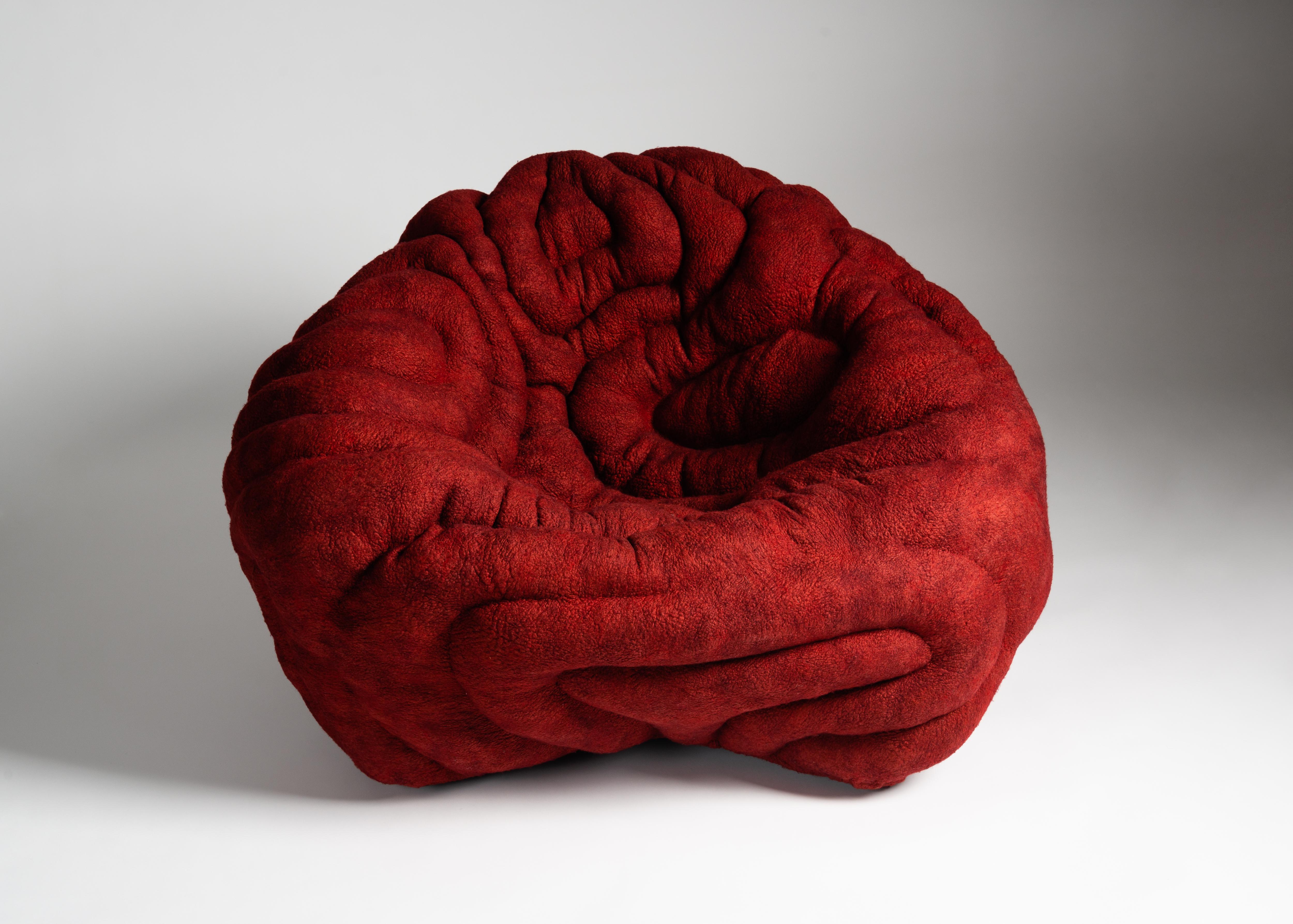 The upholstery of this chair is made of finely woven layers of felt and mimics forms in nature like seabed coral or crystalline rocks, which develop over years of growth or accretion. This new design by Ayala Serfaty is remarkable for its textured,