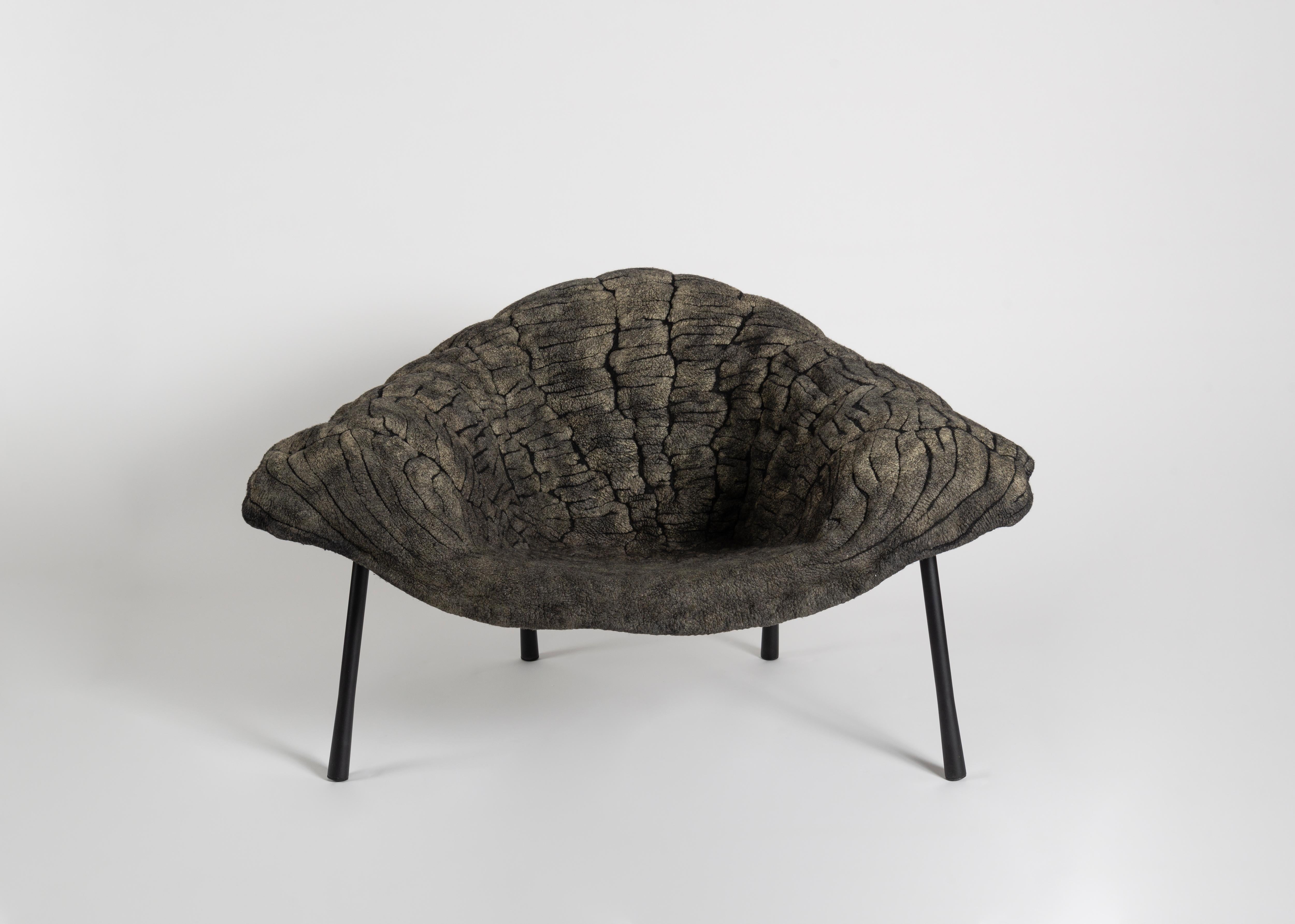 The upholstery of this chair is made of finely woven layers of felt and mimics forms in nature like seabed coral or crystalline rocks, which develop over years of growth or accretion. This new design by Ayala Serfaty, with its abstract, natural