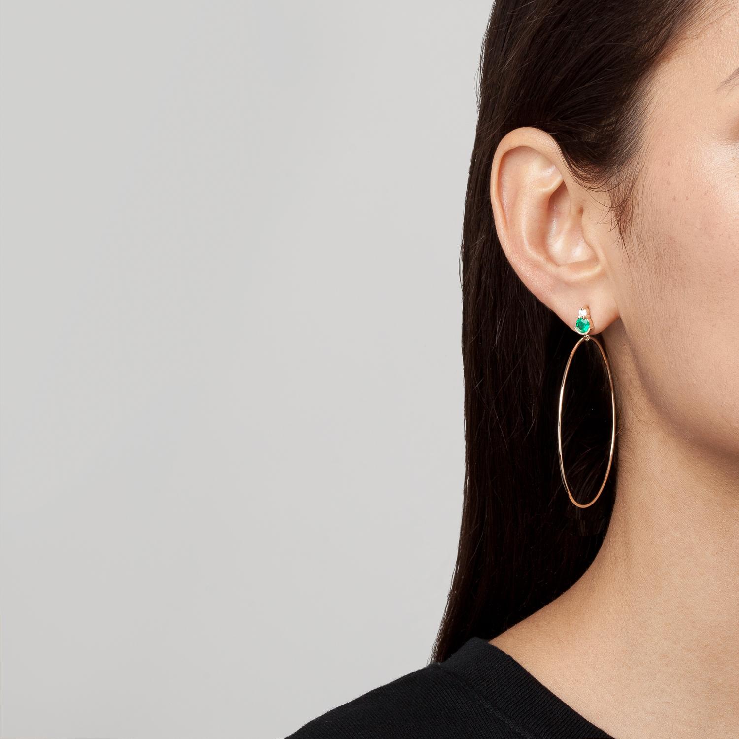 A stud and hoop hybrid, SELIN KENT's wearable Ayda Earrings make a subtle statement. Featuring stunning green emeralds with diamond accents and a 2'' gold hoop. 

Hoops measure 2'' / 5cm in diameter. 
Emerald carat weight: 0.9-1 carat
Diamond carat