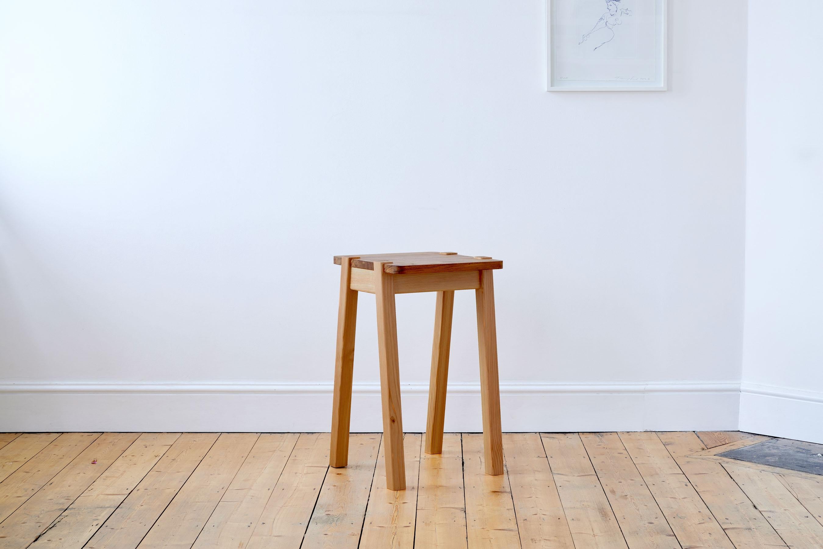 A modern statement in any home, its minimal design marries two contrasting yet complementary wood types - rich elm and warm beech - and features thoughtful brass detailing. 

The chair is designed and handmade-to-order by our Designer and Maker,