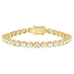 Bracelet tennis en or 14 carats avec lunette ronde et diamants