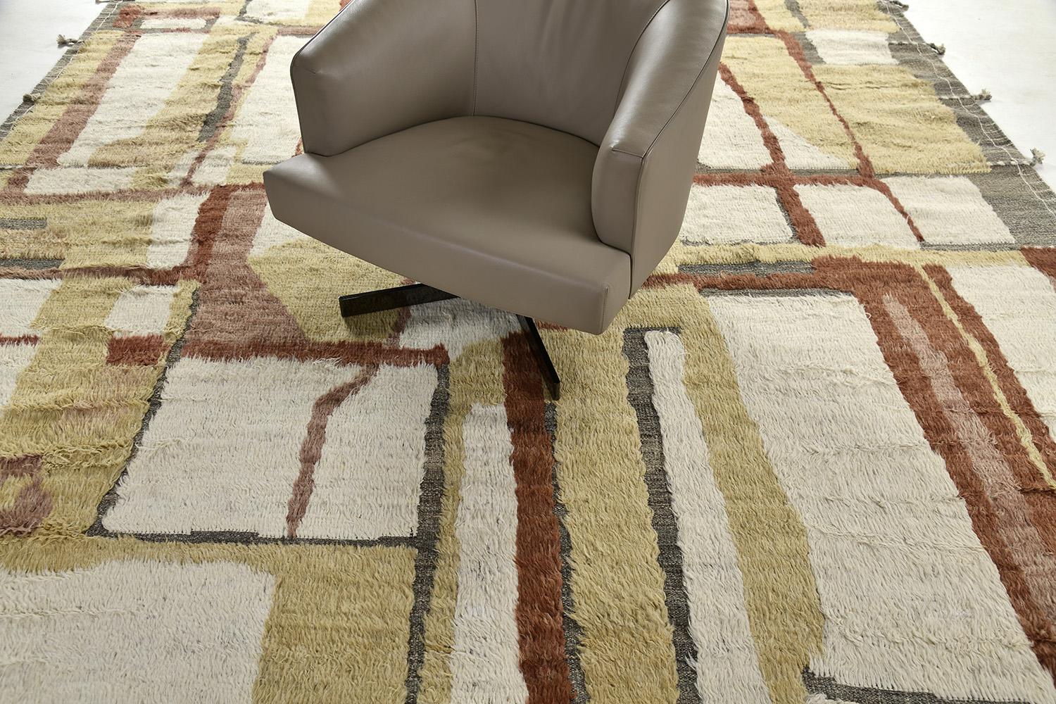 'Aziza' is a warm and lustrous wool rug with a unique play of colors and irregular shapes. This pile weave has embossed textures and unique tassel detailing which makes this piece highly sought after. Mehraban's Atlas collection is noted for their