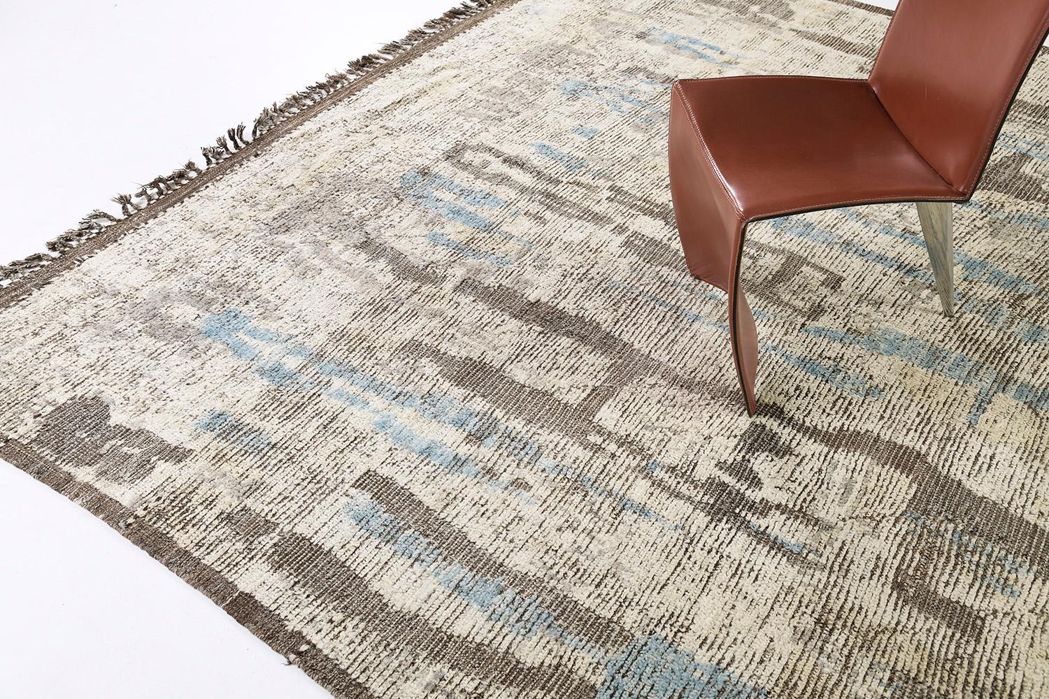 Aziza is a warm and lustrous wool rug with a unique play of colors and irregular shapes. This pile weave has earth tones embossed textures and unique tassel detailing which makes this piece highly sought after. Mehraban's Atlas collection is noted