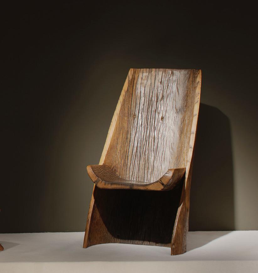 This lounge chair is an unique piece in pequi wood made in Brazil in 2017, by contemporary designer Hugo França, famous for his sculptural furniture using reclaimed wood and preserving the organic forms of the tree. This piece was originally a canoe