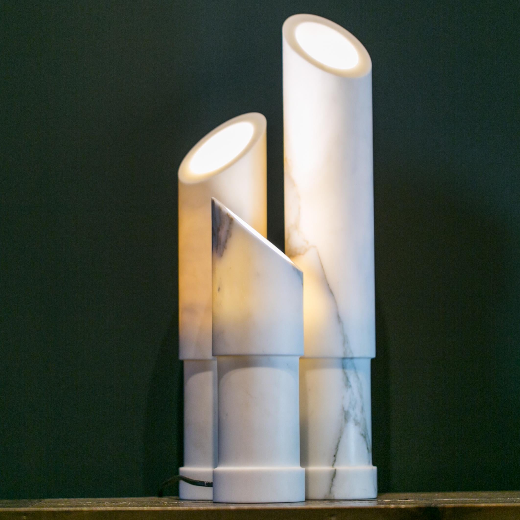 The Azoth Lamp is the latest iteration of the artist’s bamboo-inspired ensemble of marble and onyx carved objets. Evoking the morning sunlight coming through the stalks in a bamboo forest, the Azoth lamps are available as a bespoke set of lights or