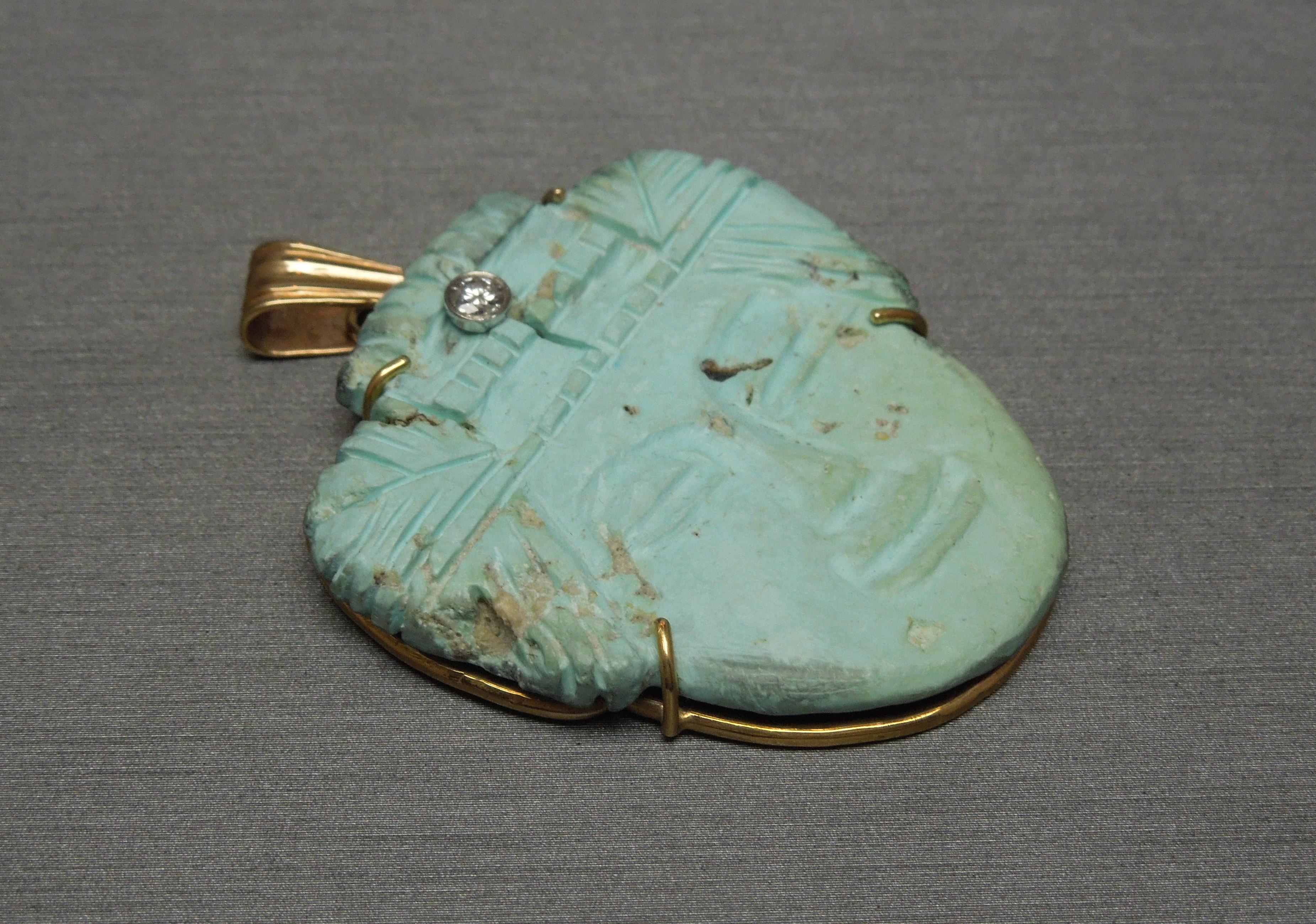 This Unisex Aztec Turquoise Amulet features 1 single piece of Hand Carved Natural Turquoise, secured in a 4-Prong Frame, with a balanced even color, as well as very little signs of striation (natural inclusions coming up to the surface of stone) ..