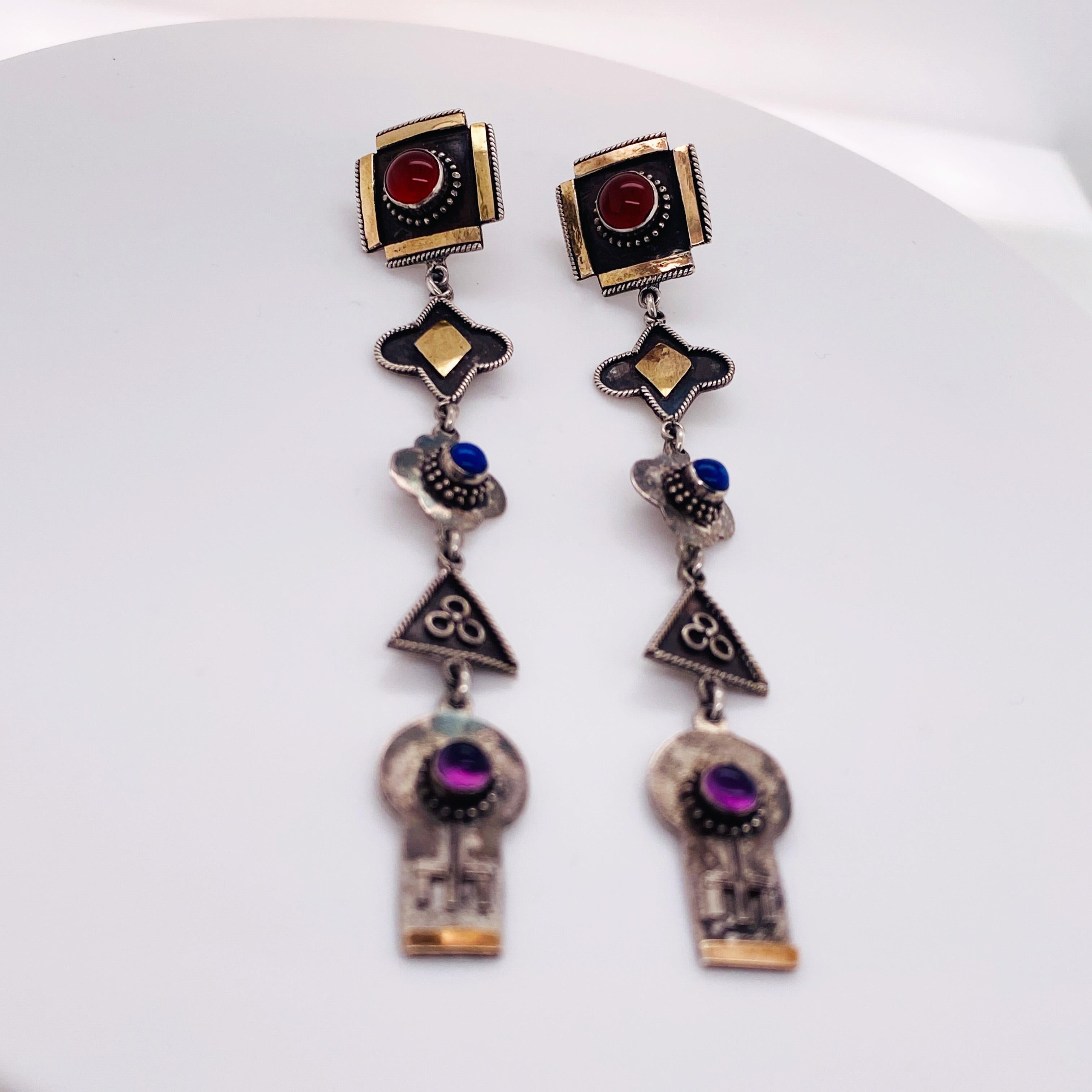 These Aztec designed, 5 tier dangle earrings have incredible workmanship. If you like long drop earrings with personality, you will LOVE these earrings! These earrings are solid sterling silver and each piece of these earrings is unique. The tops