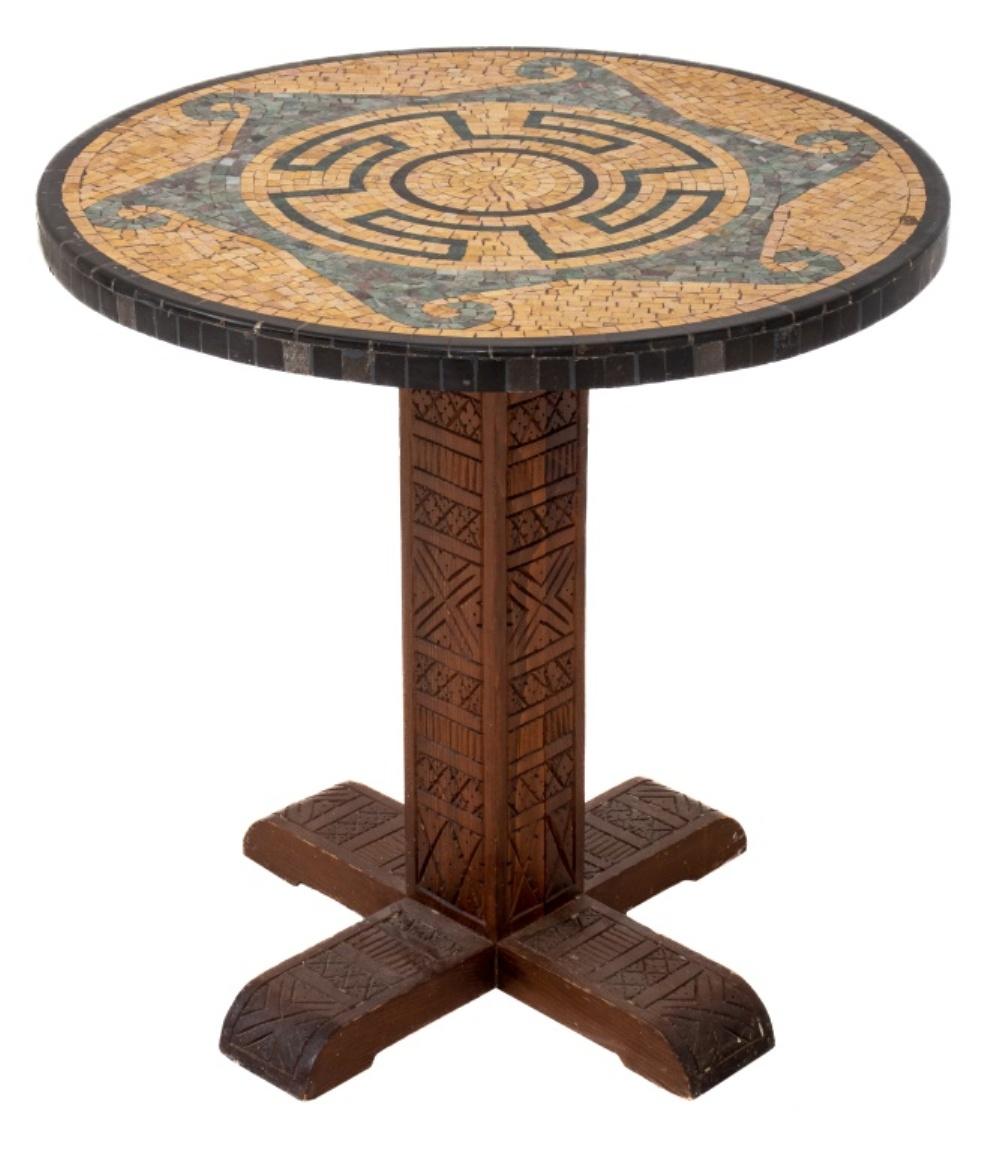 Aztec Modern Mosaic topped pedestal table, the circular top with abstracted designs, and the four footed pedestal with glyphic carvings. 

Dimensions: 25