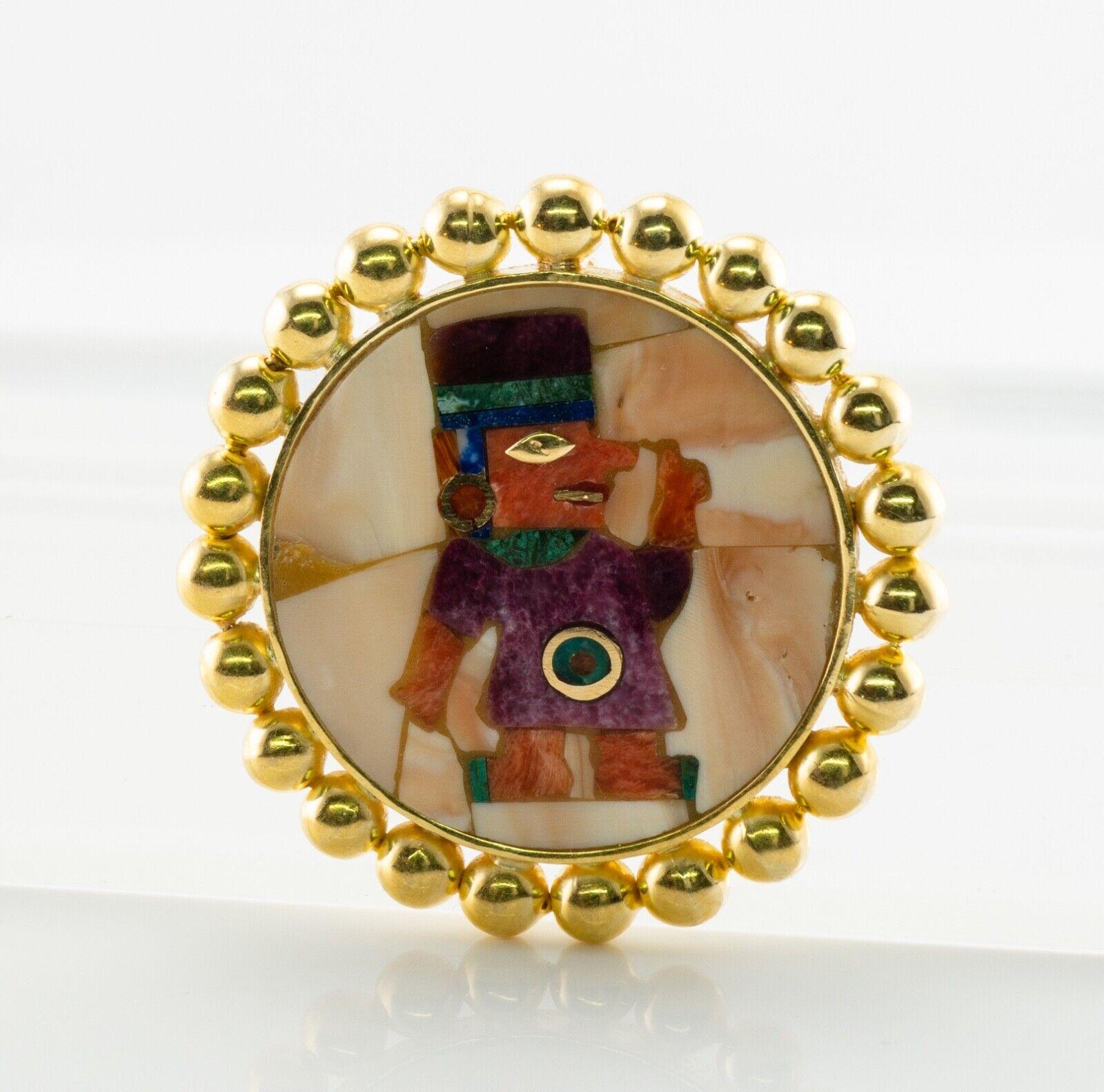 Aztec Peruvian Figure Pendant Brooch 18K Gold

This outstanding vintage piece can be worn as a pendant or a brooch. It is crafted in solid fine 18K Yellow Gold and also hallmarked with JTM. The inlaid figure of a South American man is so colorful