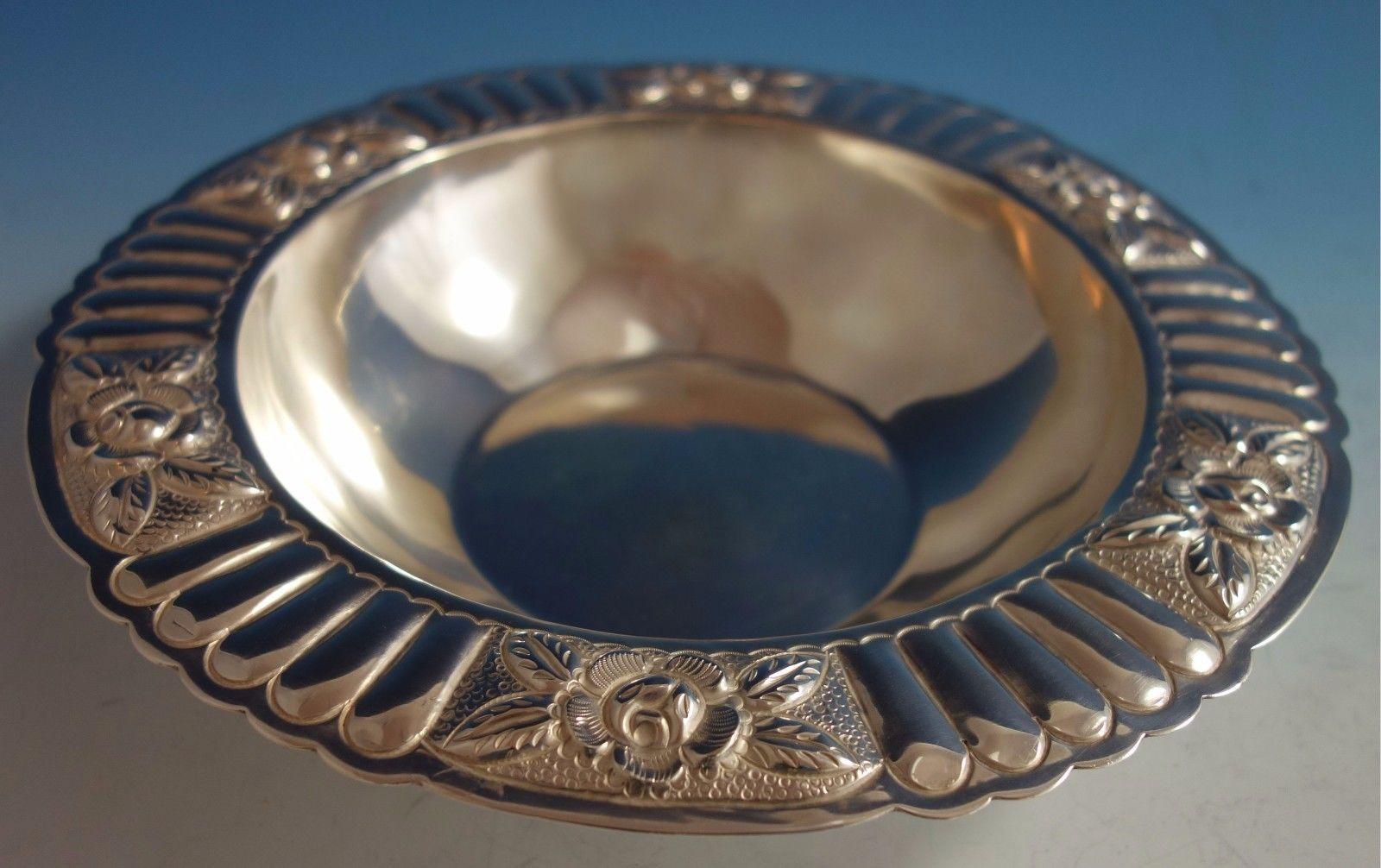 Aztec Rose by Maciel sterling silver fruit bowl. This bowl has a fluted/ruffled border. It is marked Maciel #5838-6 and weighs 13.4 ozt. This piece measures 1 3/4 tall and 9 3/4 diameter. It is not monogrammed and is in excellent condition.