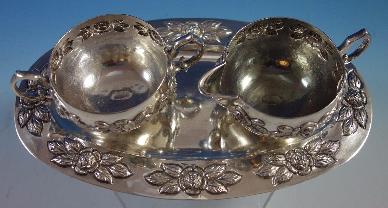 Aztec rose by Sanborns sterling silver 3-piece sugar and creamer set with tray in the pattern Aztec Rose by Sanborns. This set weighs 18.2 troy ounces total. This set includes: 1 - Tray: Measures 1/4 tall, 10 3/4 long, and 6 wide. 1 - Sugar: