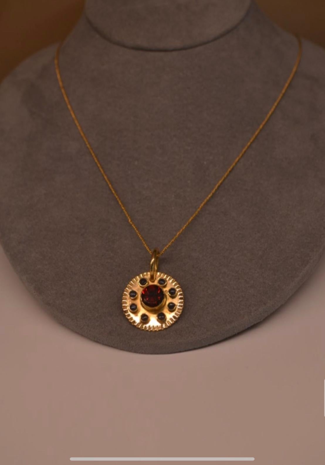 Aztec Sun Pendant in 18k Gold with Granate and 8 Sapphires In New Condition For Sale In Miami, FL