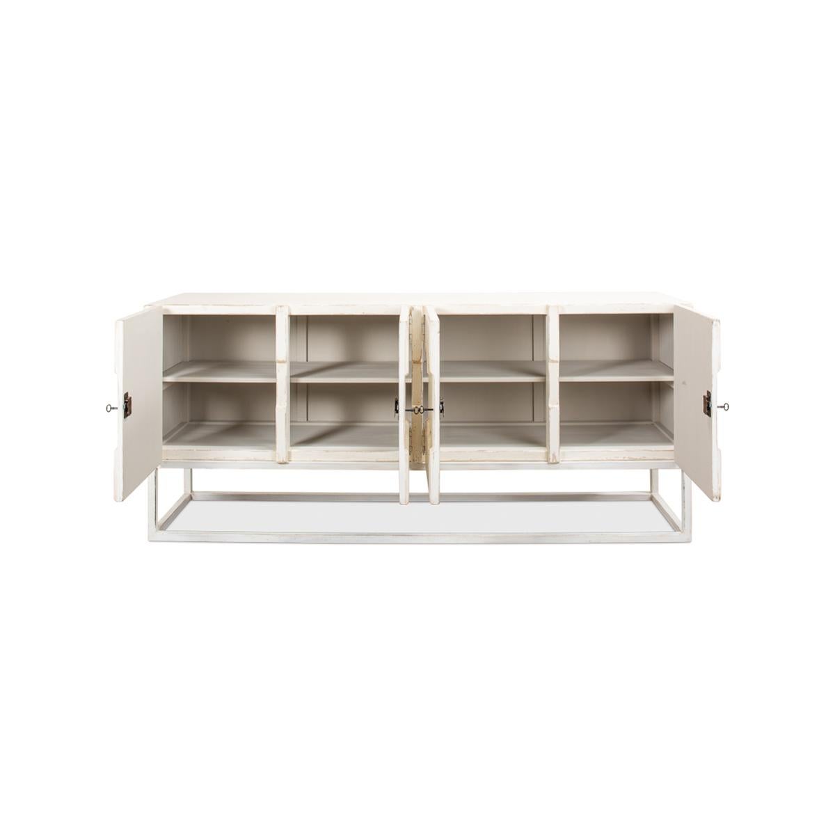 Made with reclaimed pine in an antiqued and distressed whitewash finish. With applied molding inspired by Aztec design. The painted interior with removable shelves and raised on a modern open cube form base.

Dimensions: 80