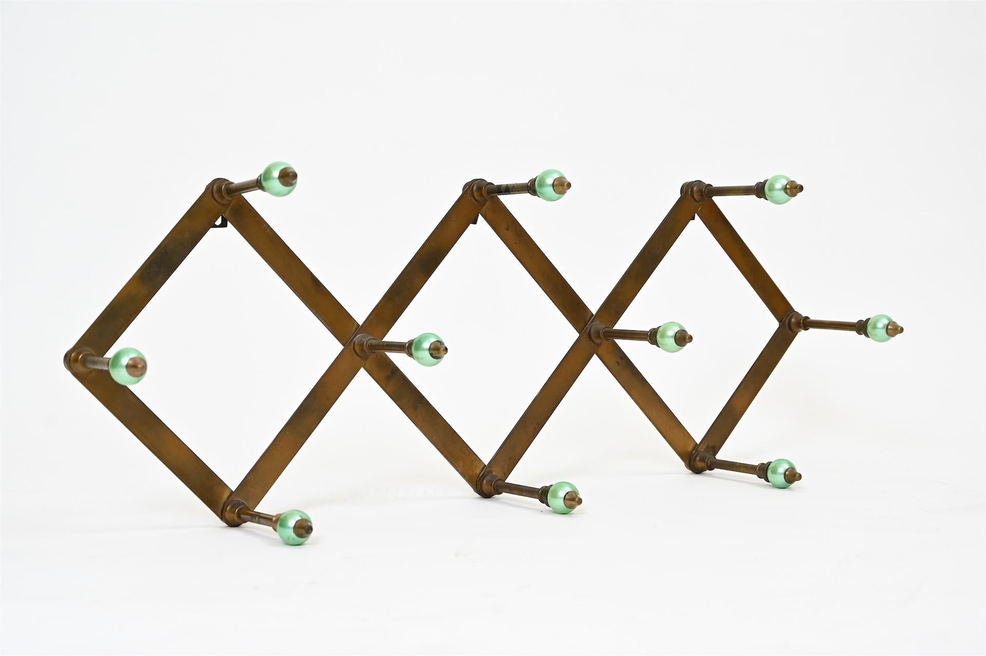 Azucena coat hooks by Lugi Caccia Dominioni, Italy, circa 1950.

Original condition with lovely patina to brass.