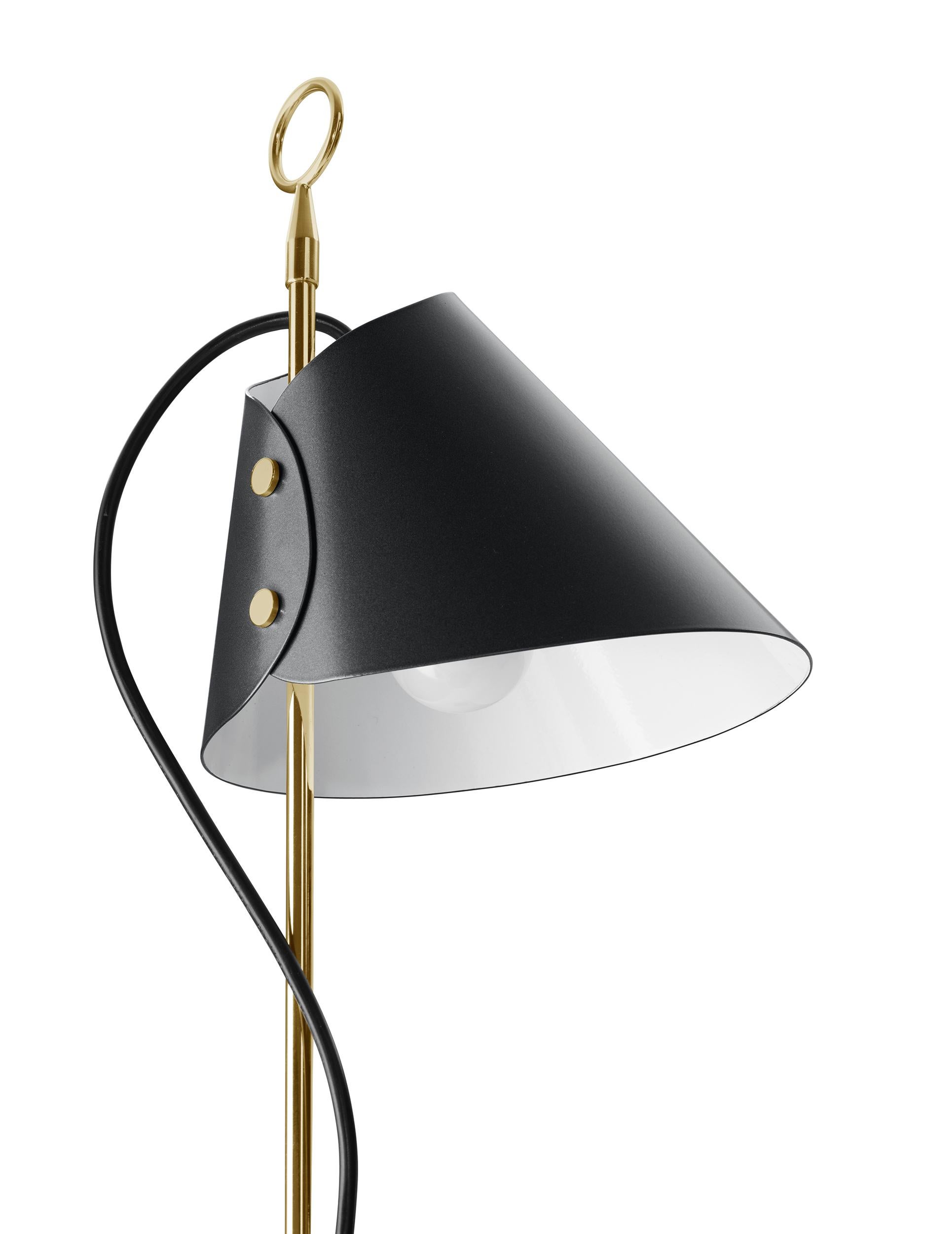 Stem in polished brass, base in black painted cast iron. Sliding reflector in metallic grey aluminium. Designed by Luigi Caccia Dominioni in 1953 for Azucena. Contemporary re-edition made by Azucena.