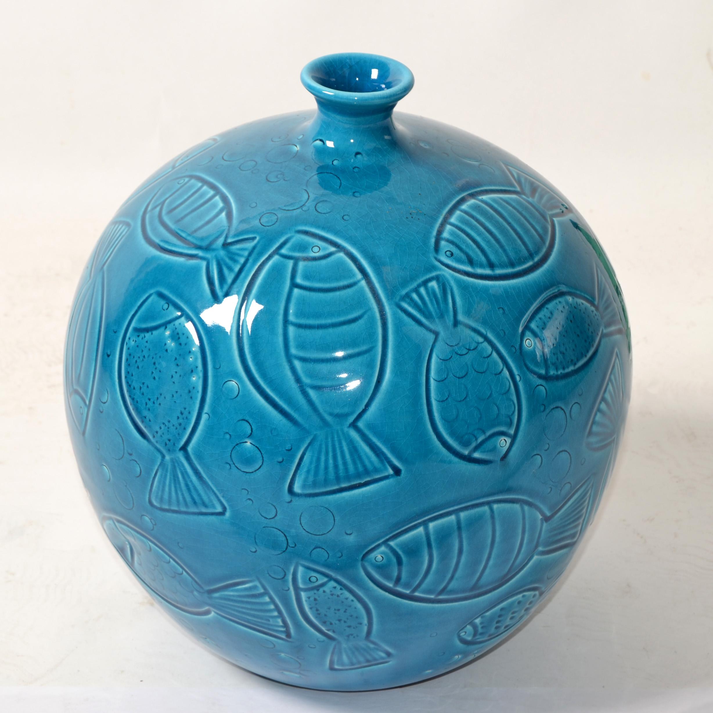 Marked Azur Blue Italy Pottery Vase Round Fish Vase Ceramiche Tadinate Handmade Pottery Coastal Living Home Decor.
Marked with the Ceramiche Tadinate Trademark, Made in Italy.
Beautiful Nautical Turquoise Ocean Clay Fine Art Vase.       
Opening