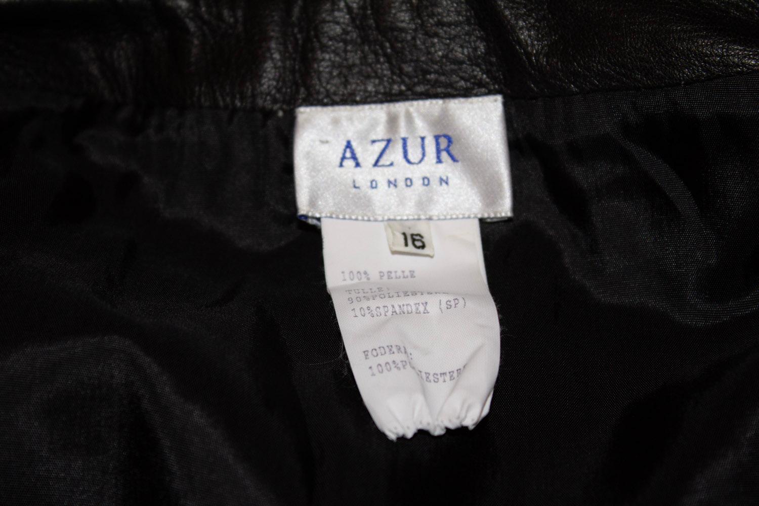 A fun black leather and lace skirt by Azur London.
The skirt is in super soft leather and is partially lined. It has a zip opening. Size 16
Measurements: waist 34'' , length 35''.
