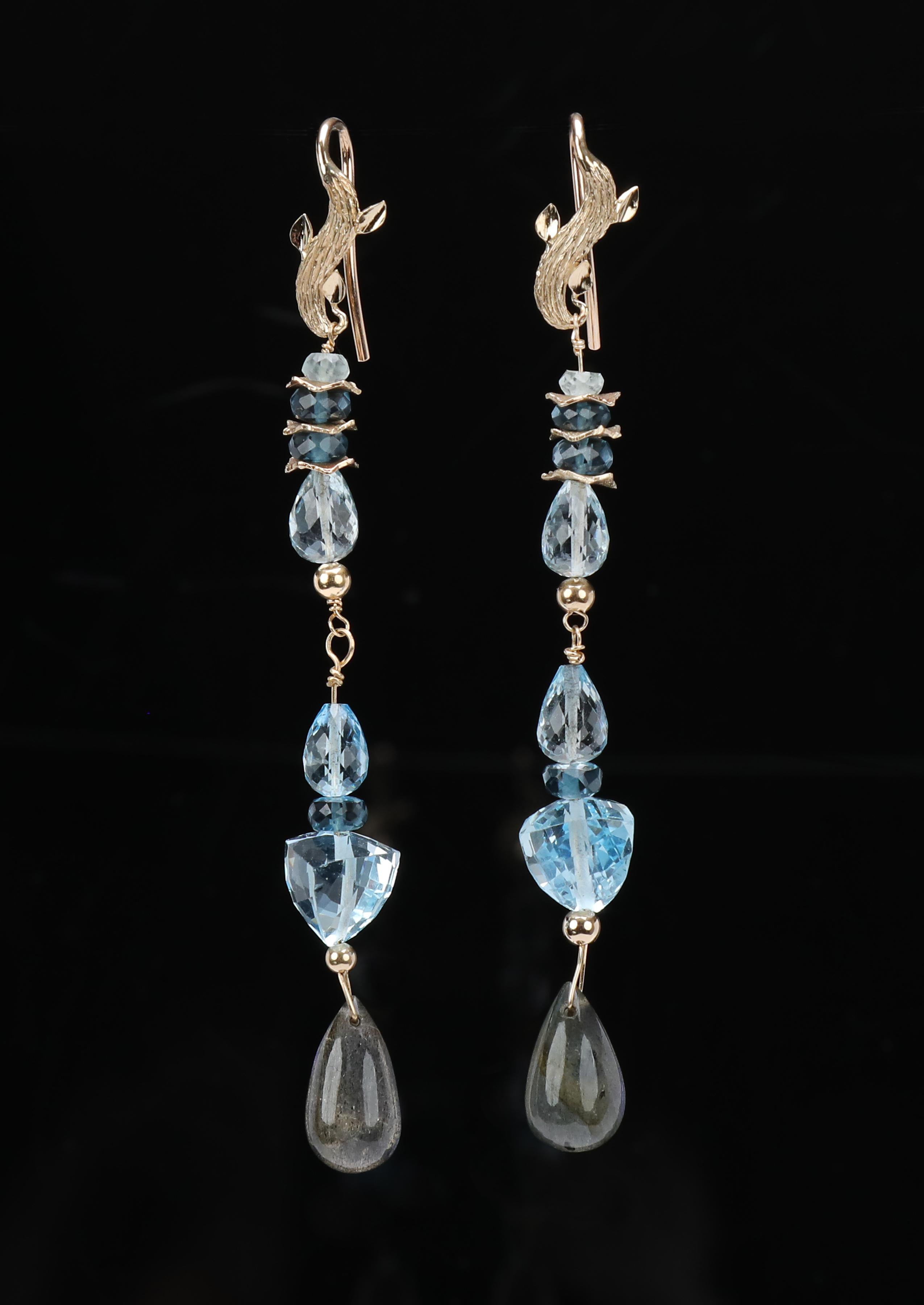 Sky and London Blue Topaz, and Labradorite cascade from our custom ear wire to create an amazing column of mixed shaped gems ending in flashing labradorite. “Azure Day” proves it is possible to dress up and down with great jewelry.  “Azure Day”