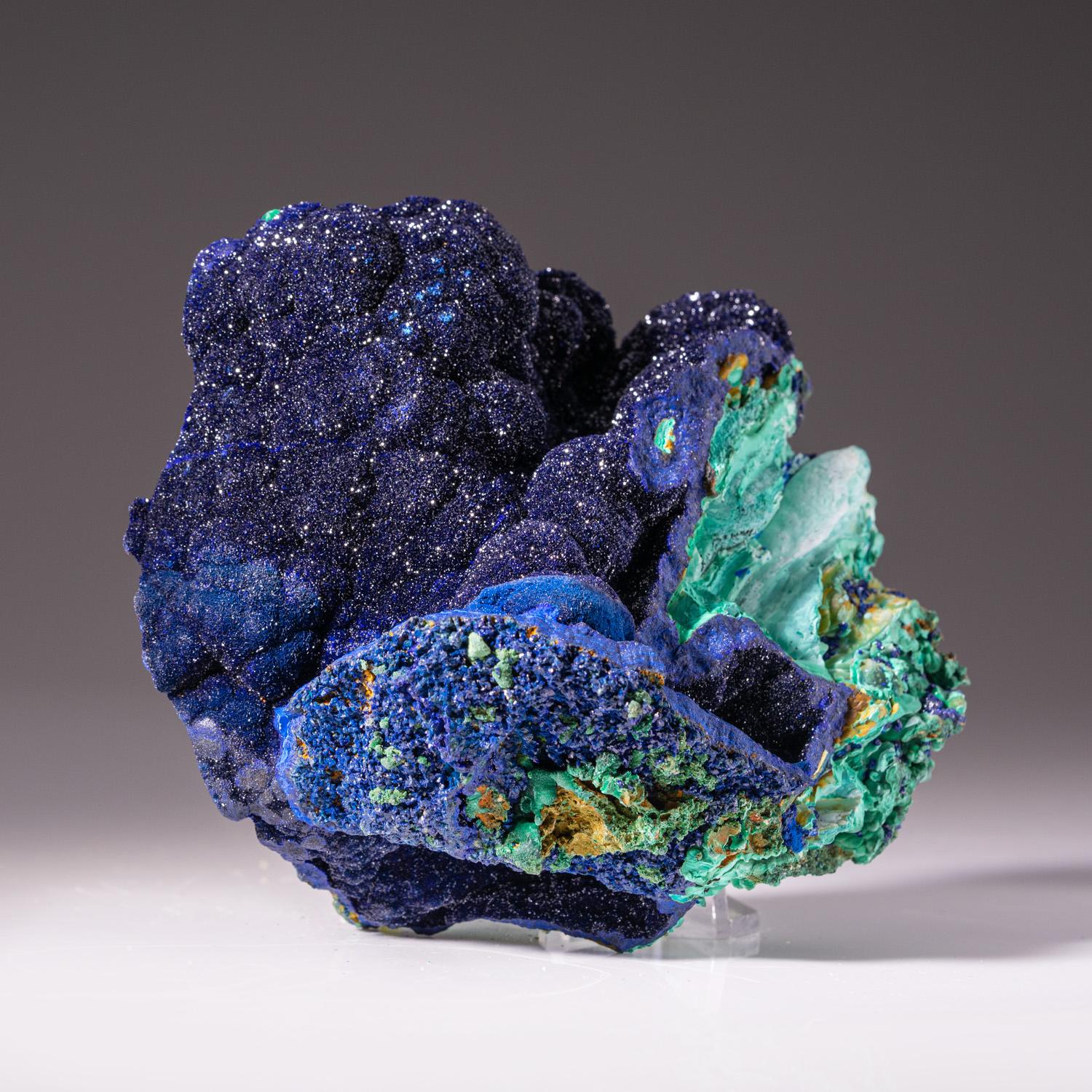 From Tsumeb Mine, Otavi-Bergland District, Oshikoto, Namibia

Rich cluster of lustrous deep royal blue azurite crystals on malachite-duftite-calcite matrix. All of the azurite crystals are highly lustrous with complex crystal development.

Weight: