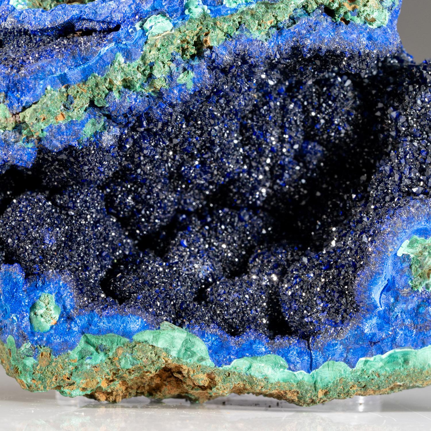 From Tongshankou Mine, Daye, Huangshi, Hubei, China

Lustrous transparent dark-blue azurite crystals on limonite matrix enriched with vibrant green fibrous malachite crystals.The azurite crystals are fully terminated with highly reflect crystal