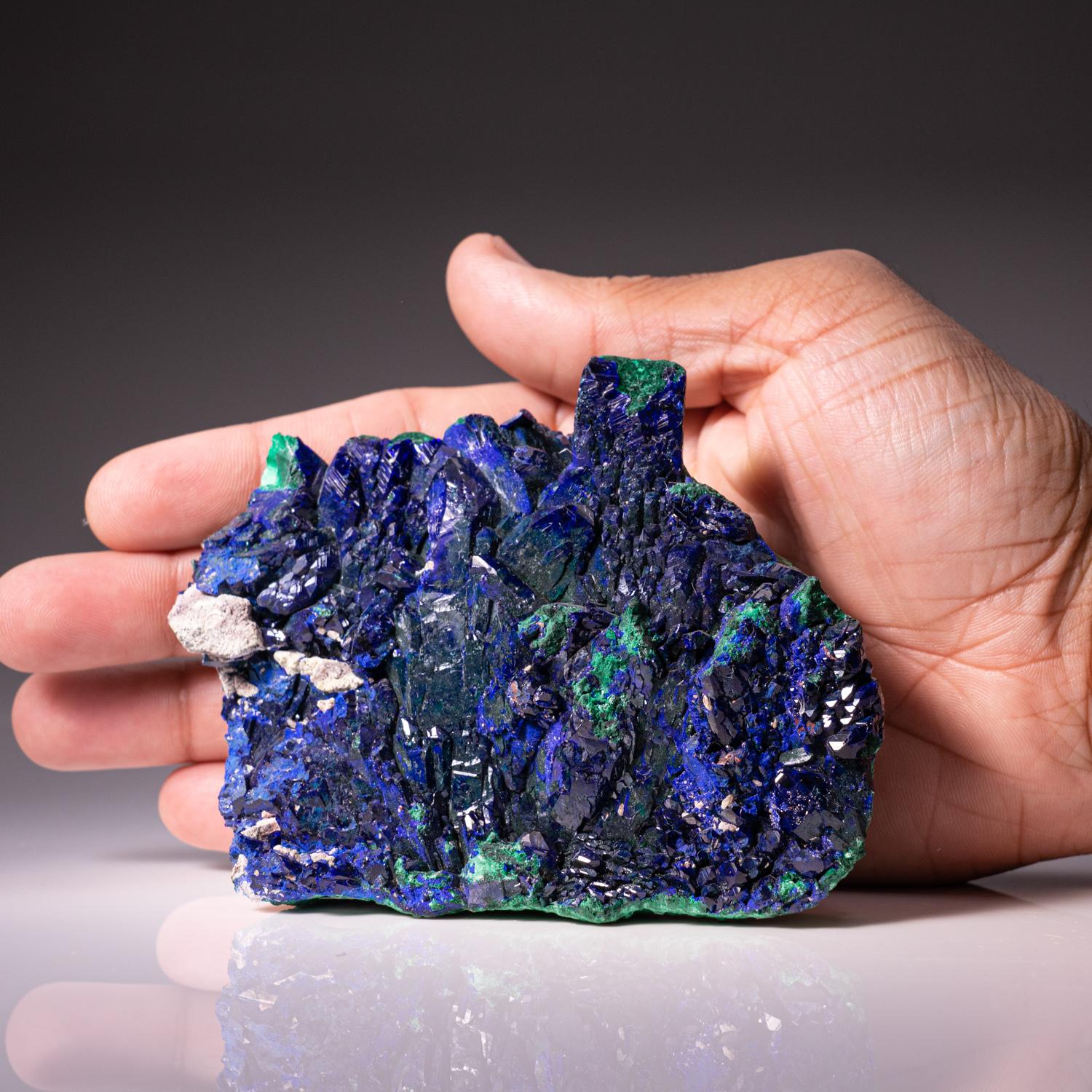 From Tsumeb Mine, Otavi-Bergland District, Oshikoto, Namibia

Rich cluster of lustrous deep royal blue azurite crystals on malachite-duftite-calcite matrix. All of the azurite crystals are highly lustrous with complex crystal development.

