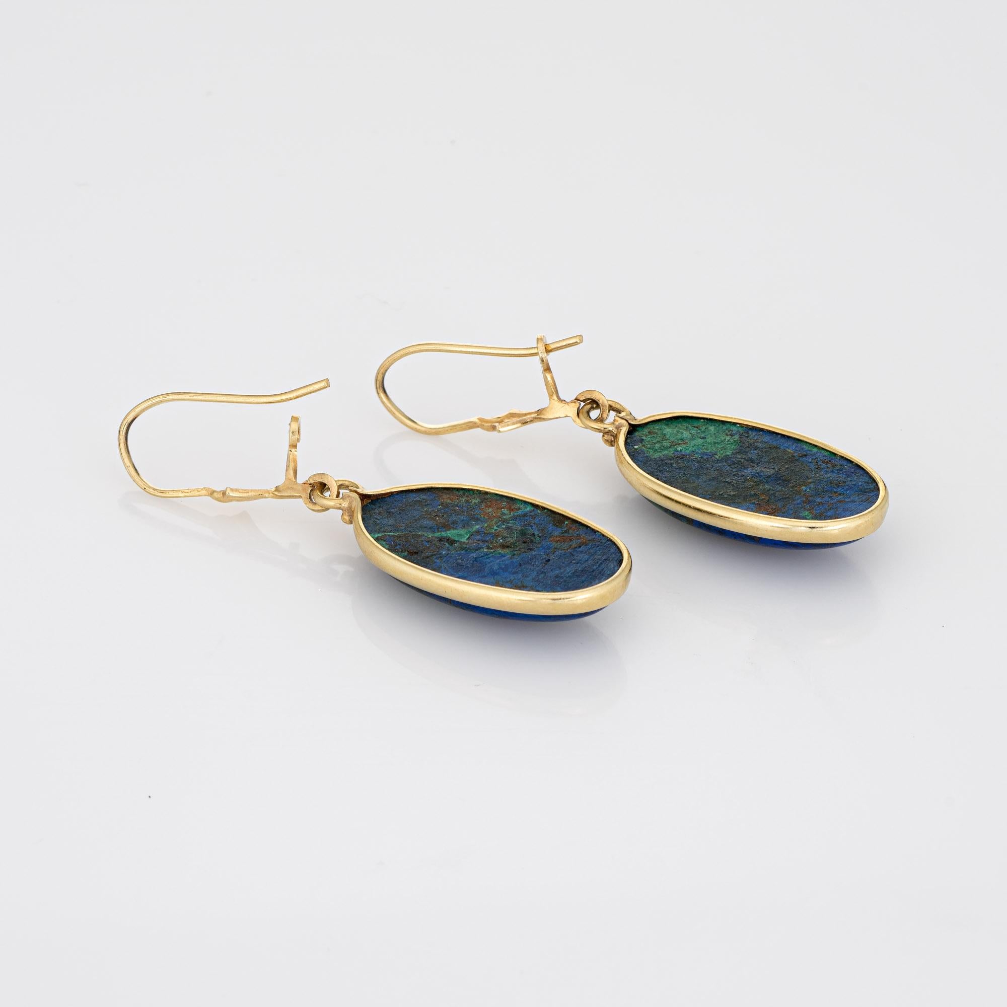 Stylish azurite drop earrings crafted in 14k yellow gold. 

Azurite measures 22mm x 12mm. The azurite is in very good condition and free of cracks or chips. 

With deep blues and vibrant greens, Azurite is a stone known for inner strength and