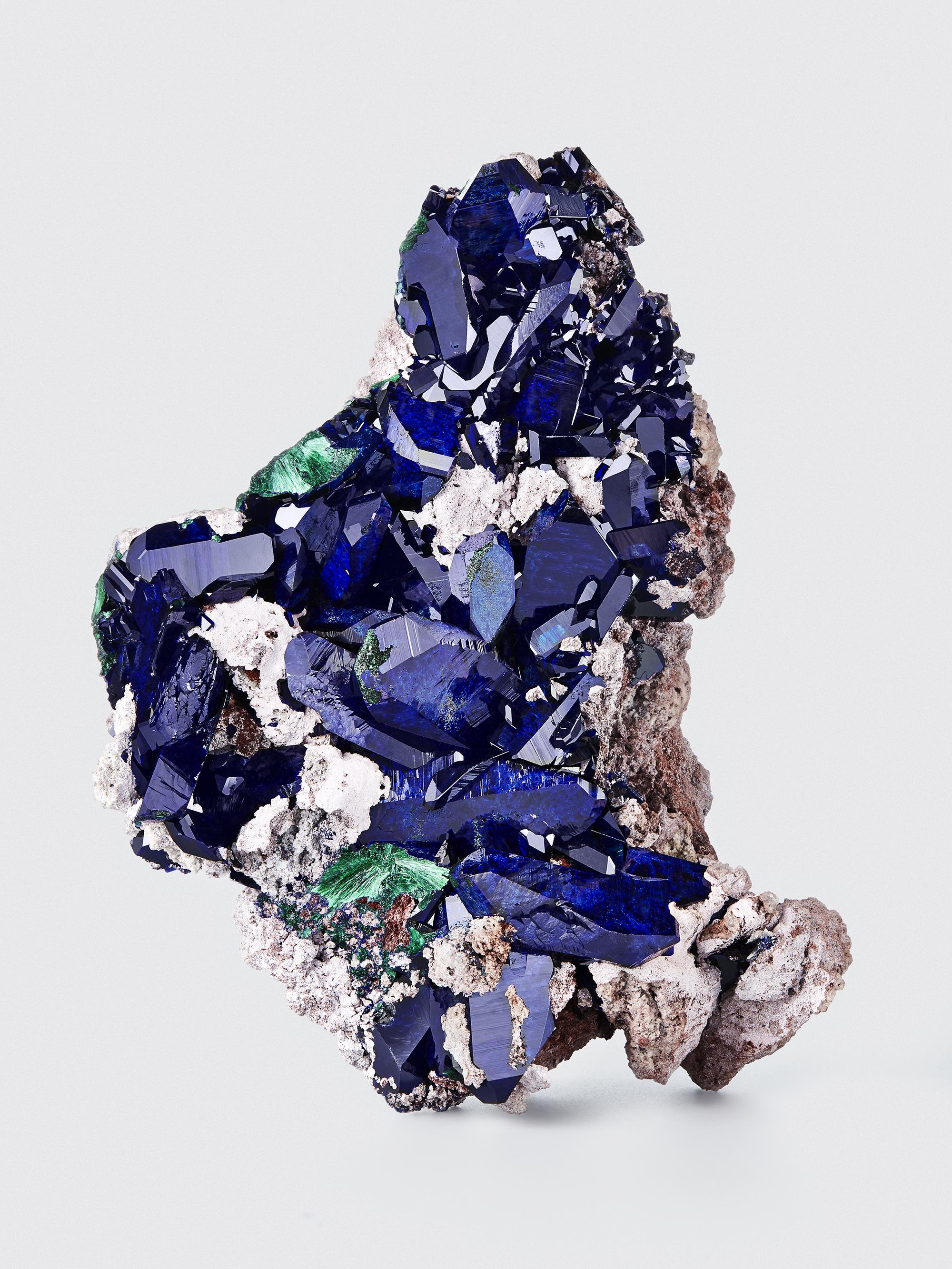 Azurite & Malachite, Milpillas Mine, Mun de Nacozari de Garcia, Sonora, Mexico.

Measures: 14 cm tall x 10.2 cm wide

Azurite of this vibrant electric blue color has only been found a few times in mining history. This specimen exhibits the color