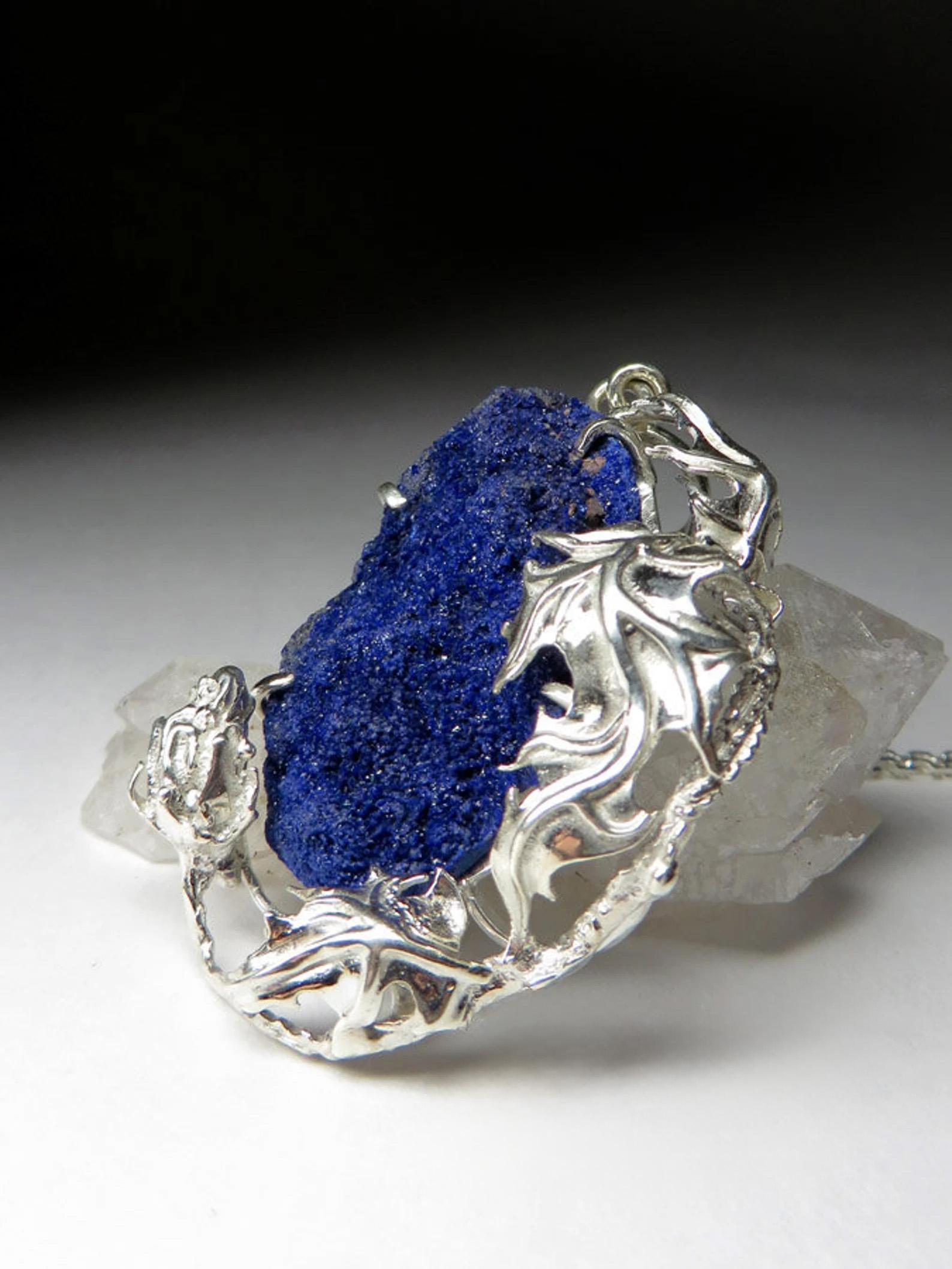 Silver pendant with natural Azurite Crystal
gemstone origin - Morocco
gem size is  1.18 х 0.79 х 0.2 in / 30 х 20 х 5 mm
pendant weight - 12.19 grams
pendant length - 2.17 in / 55 mm
The necklace comes with a silver chain. 