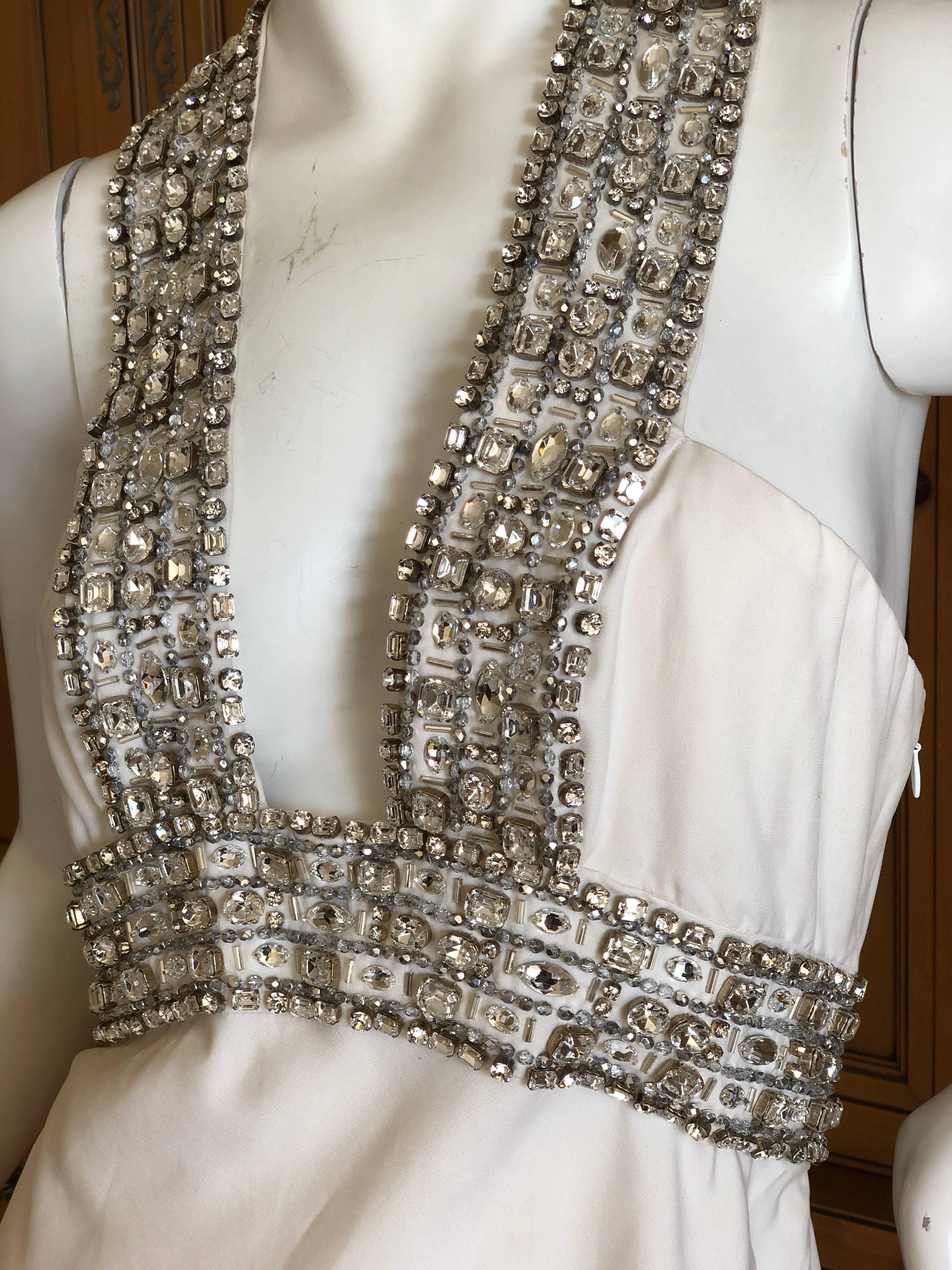 Exquisite Azzaro off white Goddess Dress with dramatic crystal jewel details around the very low cut neckline.
This is so amazing, much prettier than the photos show. 
Huge swags of crystals adorn this beautiful piece , a real showstopper.
This