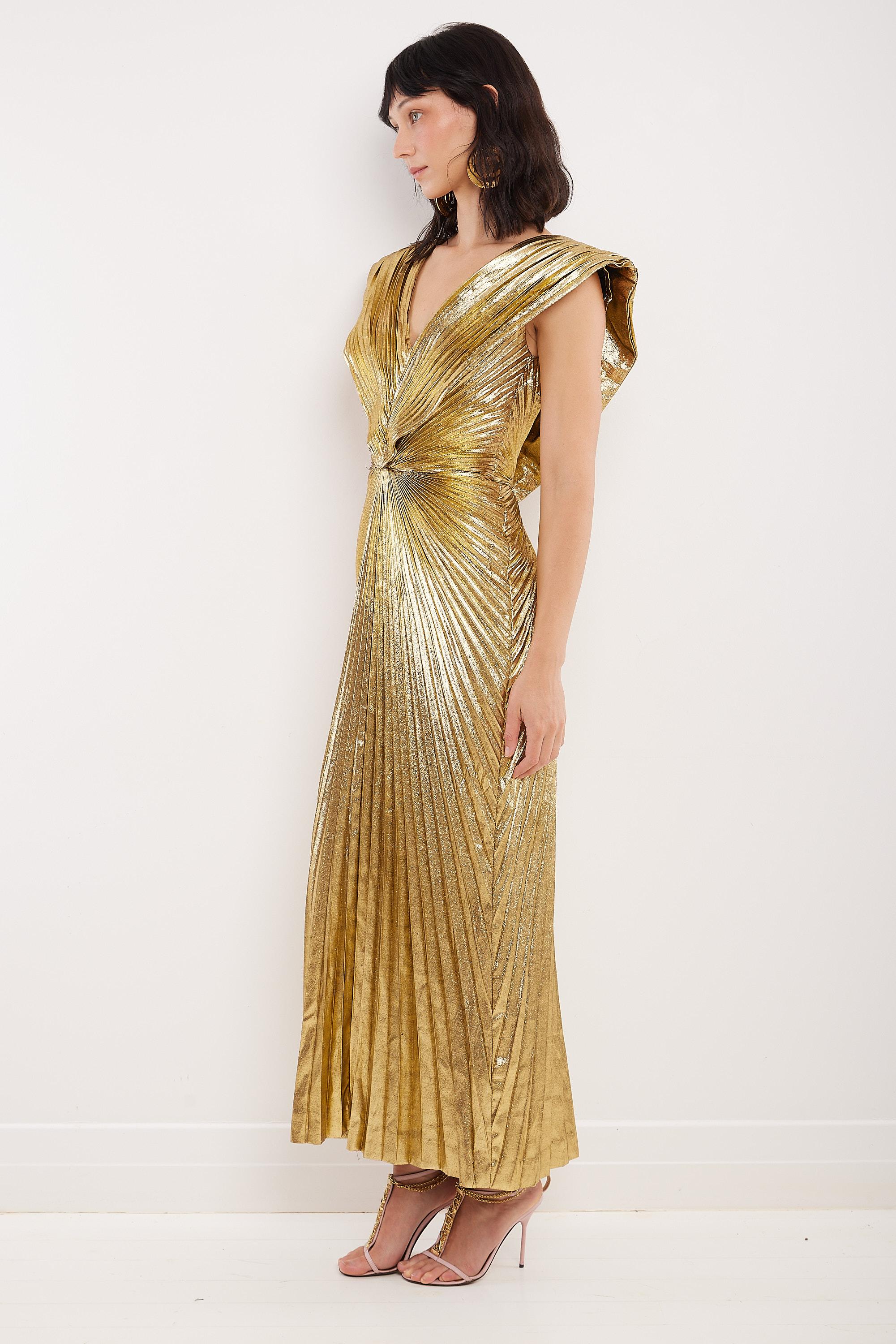 A veritable museum piece, this 1988 Loris Azzaro gown was worn by supermodel Amber Valletta to the ‘Gilded Glamour’ themed 2022 Met Gala where she was fêted as best dressed at the event. Constructed to couture standards of gold lamé, it features an