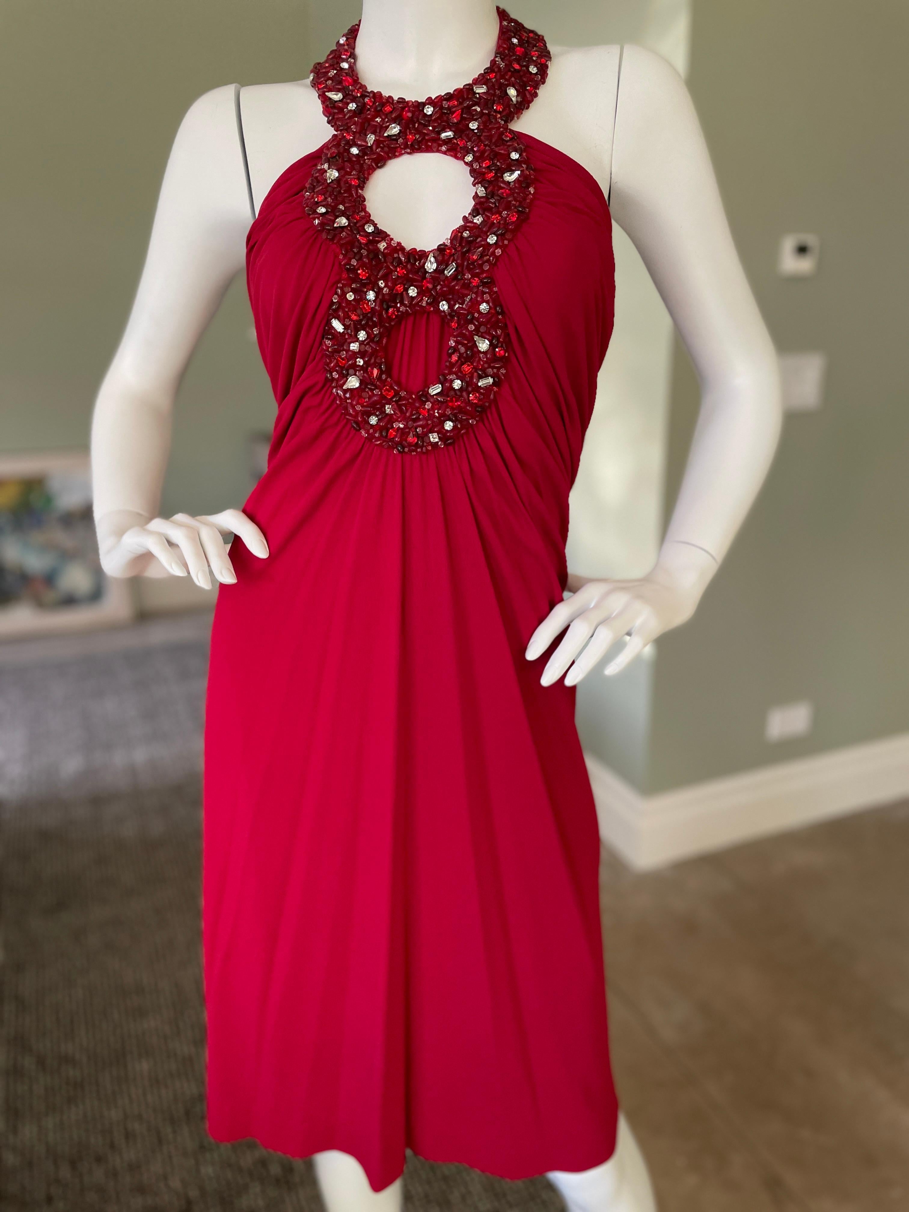 Azzaro Vintage Red Cocktail Dress with Jeweled Keyhole.
One of the keyholes is covered, but the panel could be removed to reveal skin if preferred.
Size 42
 Bust 34