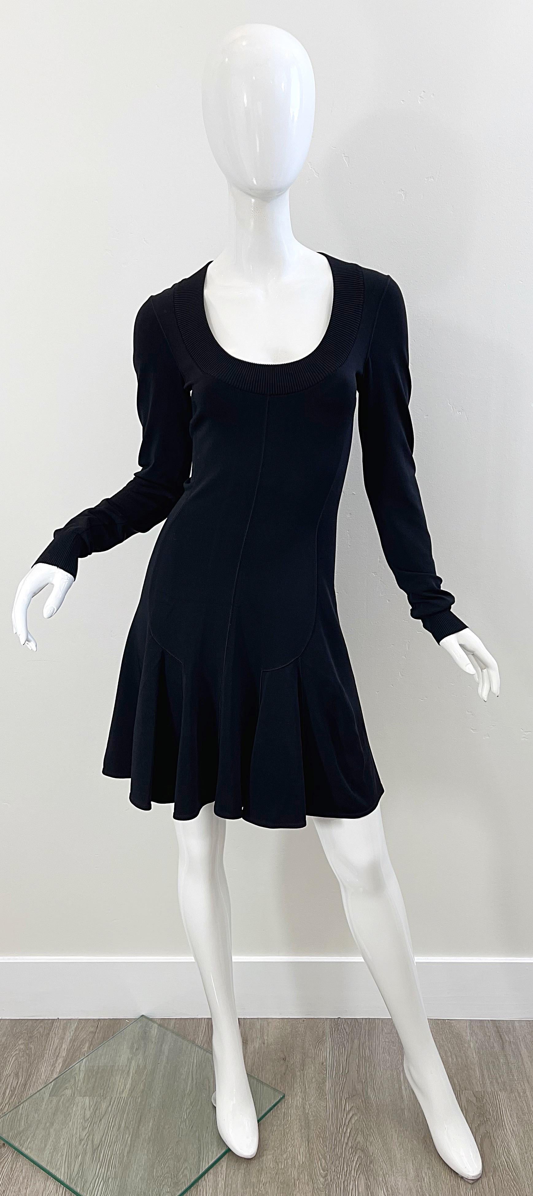 The perfect little black dress from none other than the legendary AZZEDINE ALAIA ! This early 90s piece features a tailored bodice with a flirty skater skirt. Flattering lines that only Alaia could produce. Soft jersey fabric of Rayon (60%), Nylon
