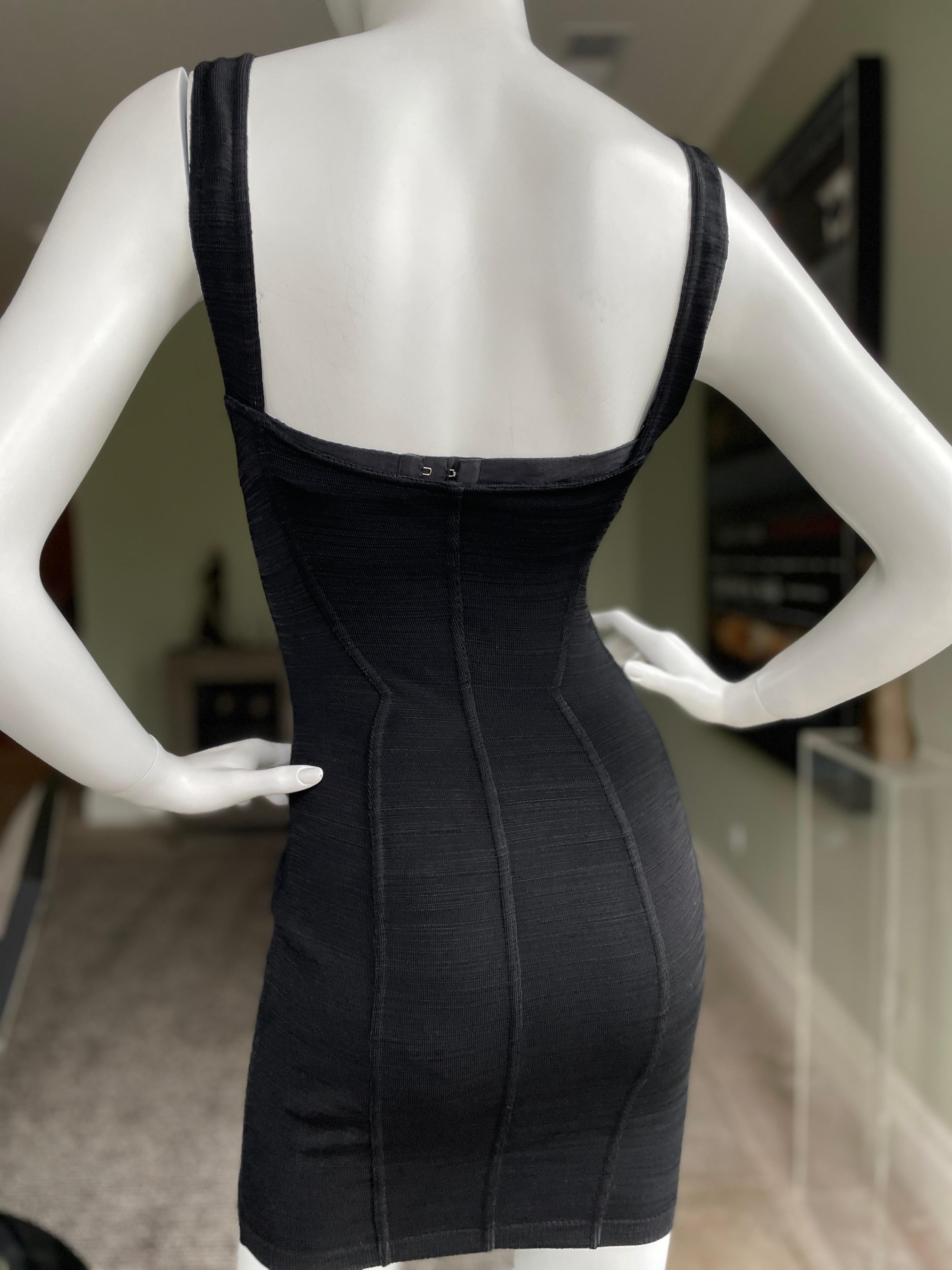 Azzedine Alaia 1990's Black Mini Dress 
Size M, measurements given lying flat, unstretched.
There is a bra attached, I don't think it is original, and could easily be removed
 Bust 36