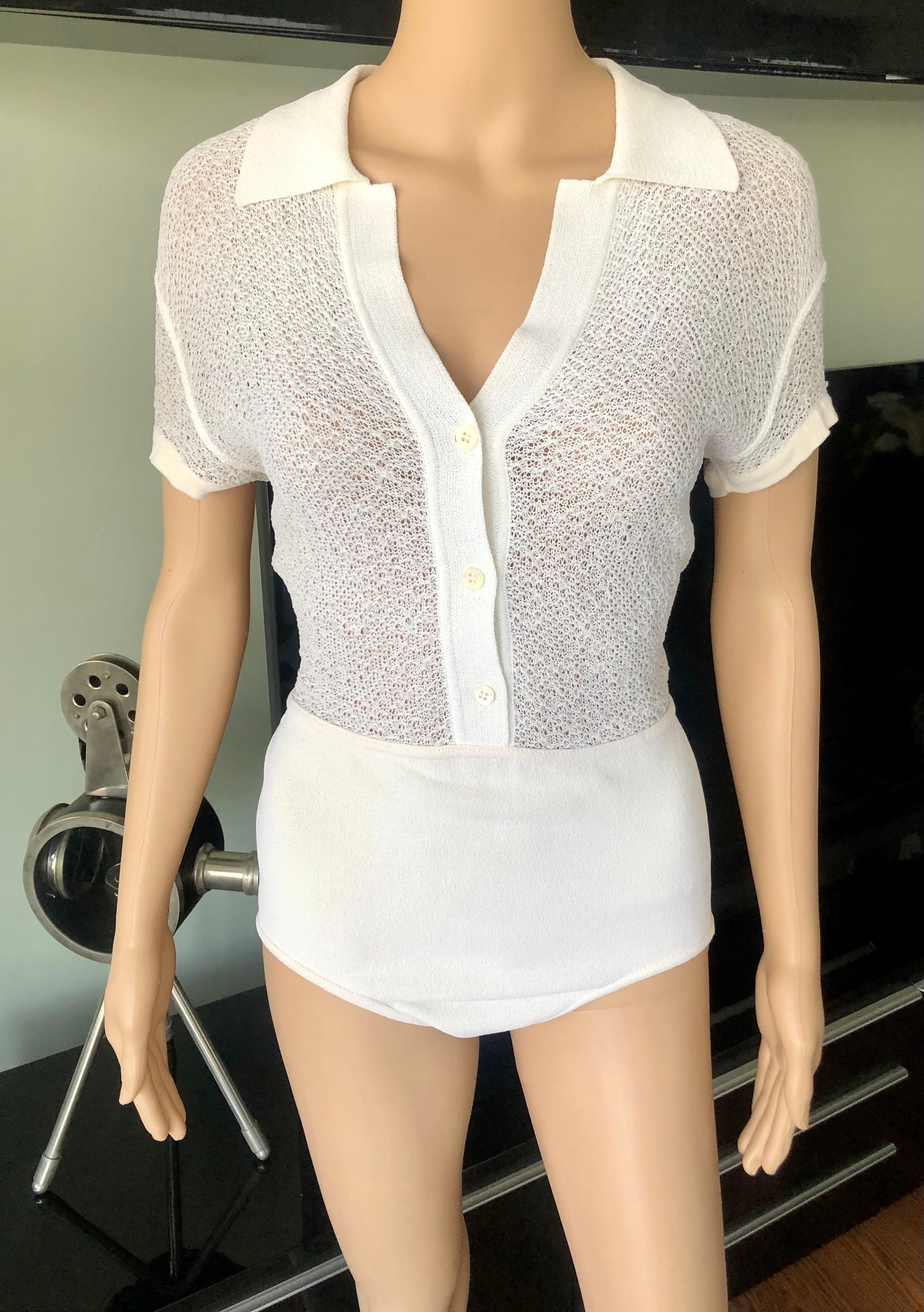 Azzedine Alaia 1990's Vintage Semi-Sheer Bodysuit Romper 

Alaïa knit bodysuit/romper featuring collar, short sleeves and button closures at hem. Please note the size and fabric tags have been removed. This item will best fit size M/L.


