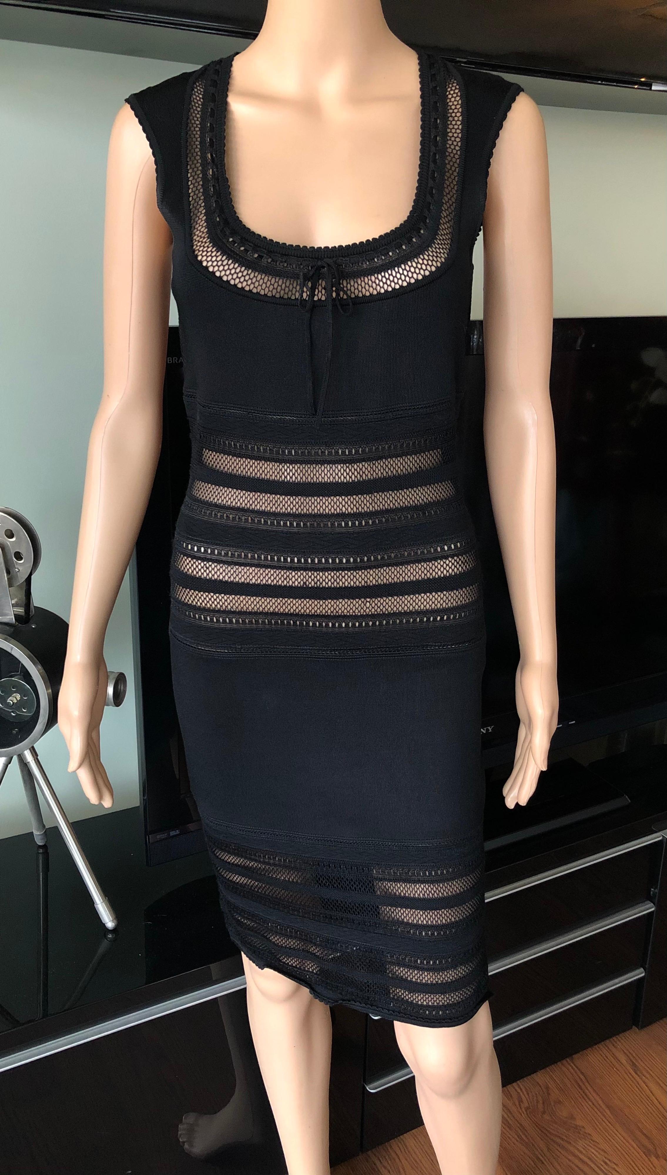 Azzedine Alaia 1990's Vintage Fitted Semi-Sheer Bodycon Black Dress Size M

Alaïa sleeveless bodycon mini dress with open knit paneling throughout, scoop neck featuring tonal bow accent at collar, scalloped trim and concealed zip closure at center