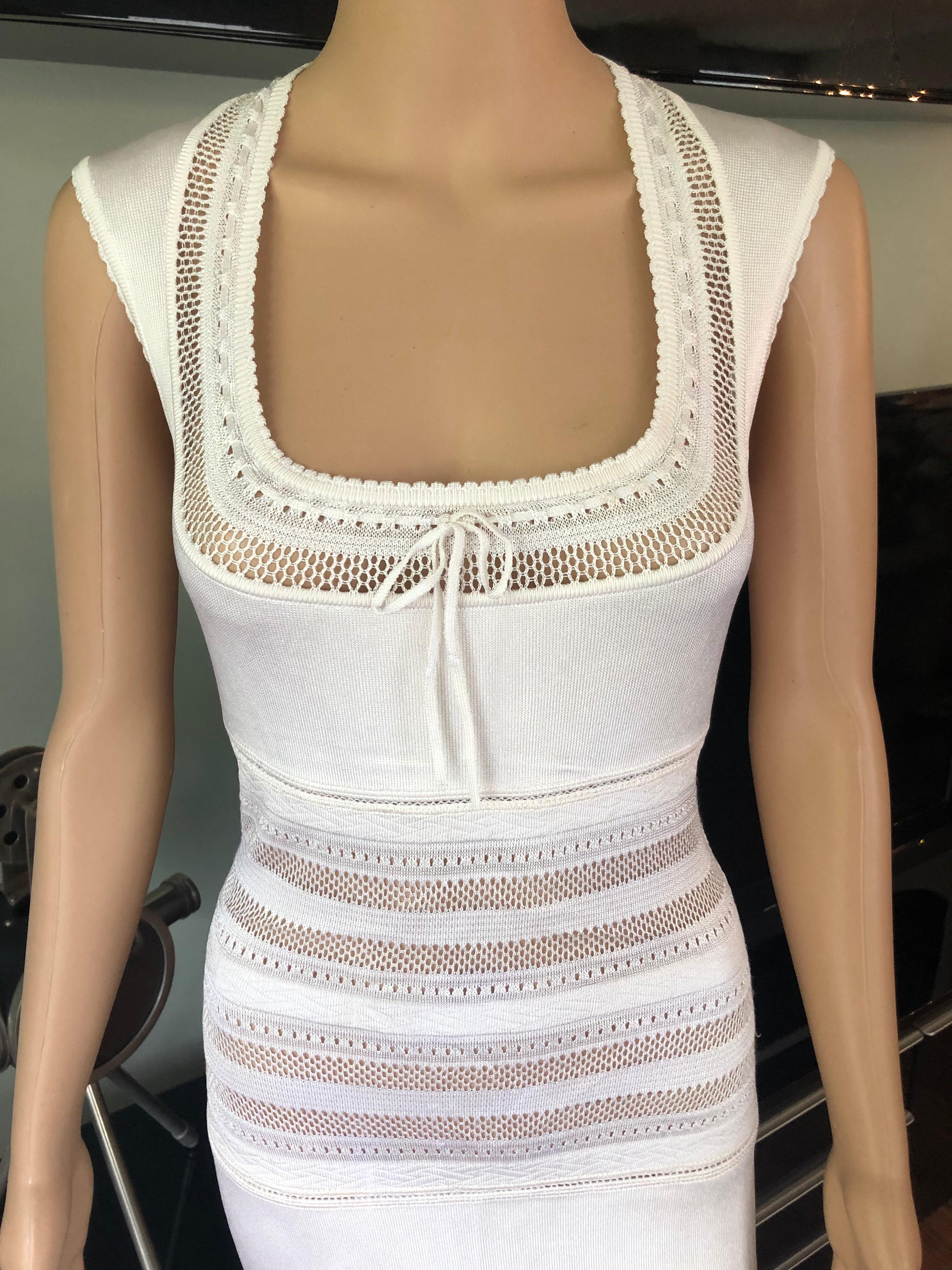 Azzedine Alaia c. 1993 Vintage Crochet Open Knit Ivory Dress M

Alaïa sleeveless bodycon semi-sheer mini dress with open knit paneling throughout, scoop neck featuring tonal bow accent at collar, scalloped trim and concealed zip closure at center