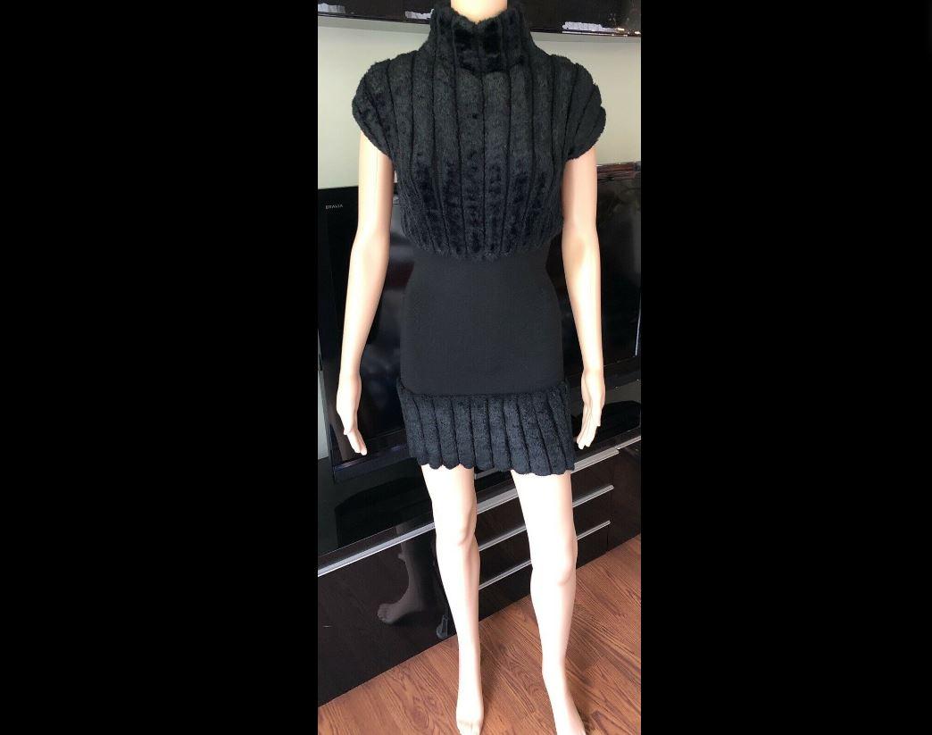 Azzedine Alaia 1994 Vintage Chenille Dress Size XS

Black Alaïa short sleeve mini dress with faux fur trim, mock neck and zip closure at back.

All Eyes on Alaïa

For the last half-century, the world’s most fashionable and adventuresome women have