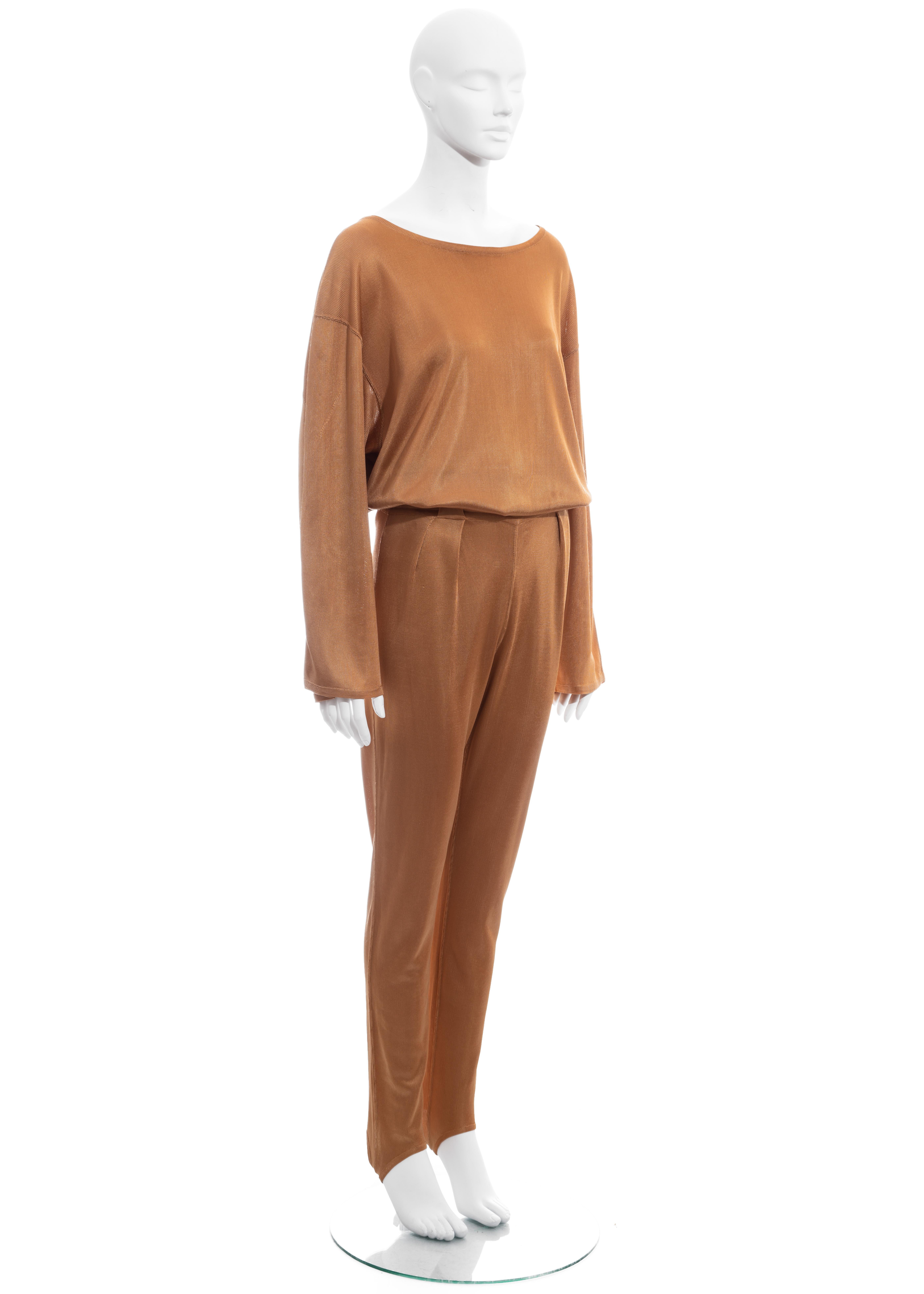 ▪ Azzedine apricot knitted pant suit 
▪ 100% Acetate 
▪ Loose cut sweater with wide sleeve
▪ High waisted pants with stirrups 
▪ Size Medium
▪ Fall-Winter 1985