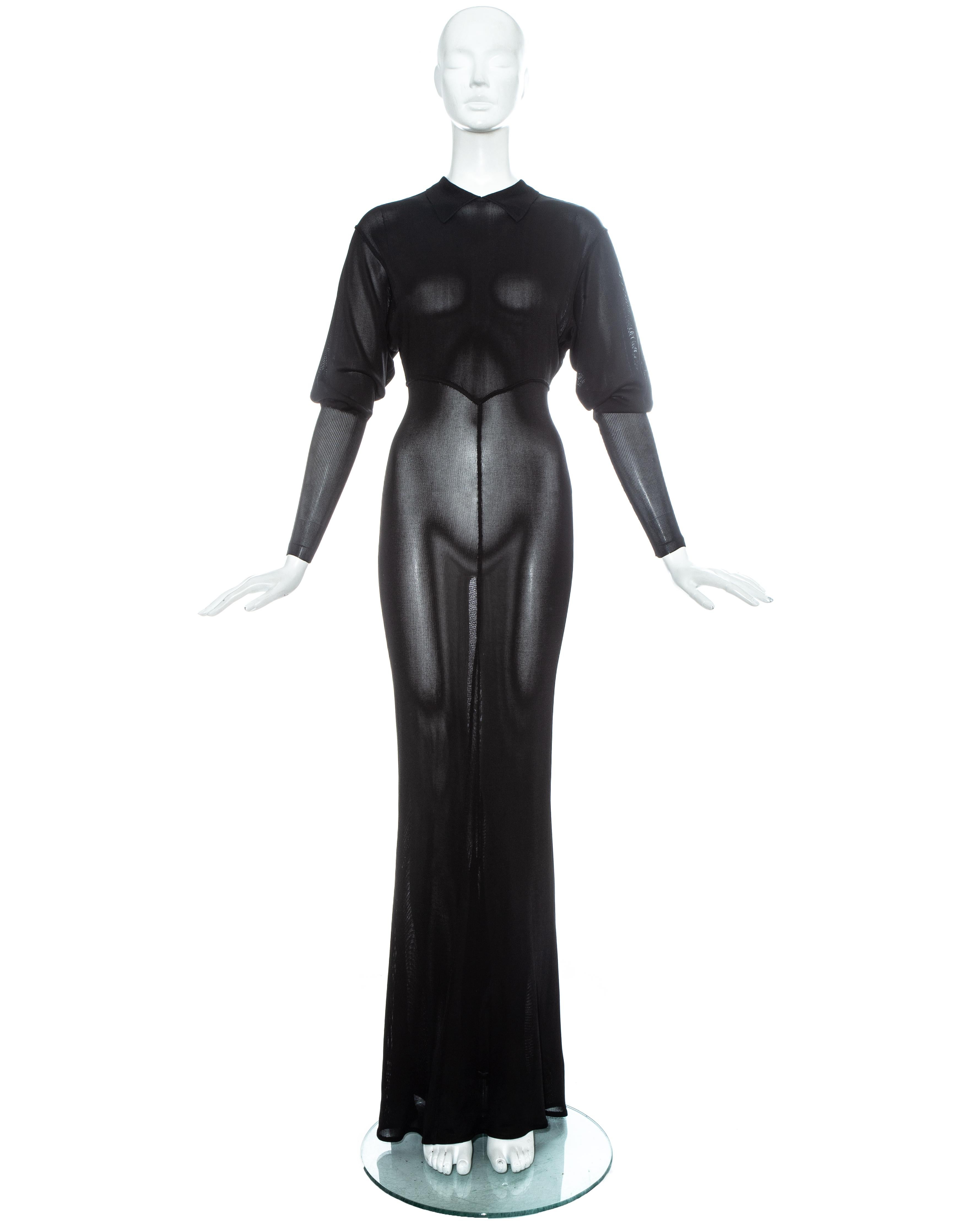 Azzedine Alaia black acetate knit evening maxi dress with pointed collar, opening at the back and train.

Fall-Winter 1986

