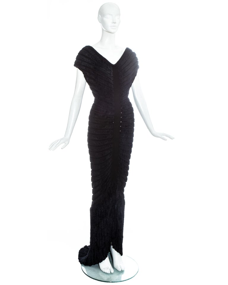 Azzedine Alaïa black chenille-knitted 'Houpette' evening dress. Sculpted figure-hugging design with concentric chenille bands and trained hem.

Spring-Summer 1994
