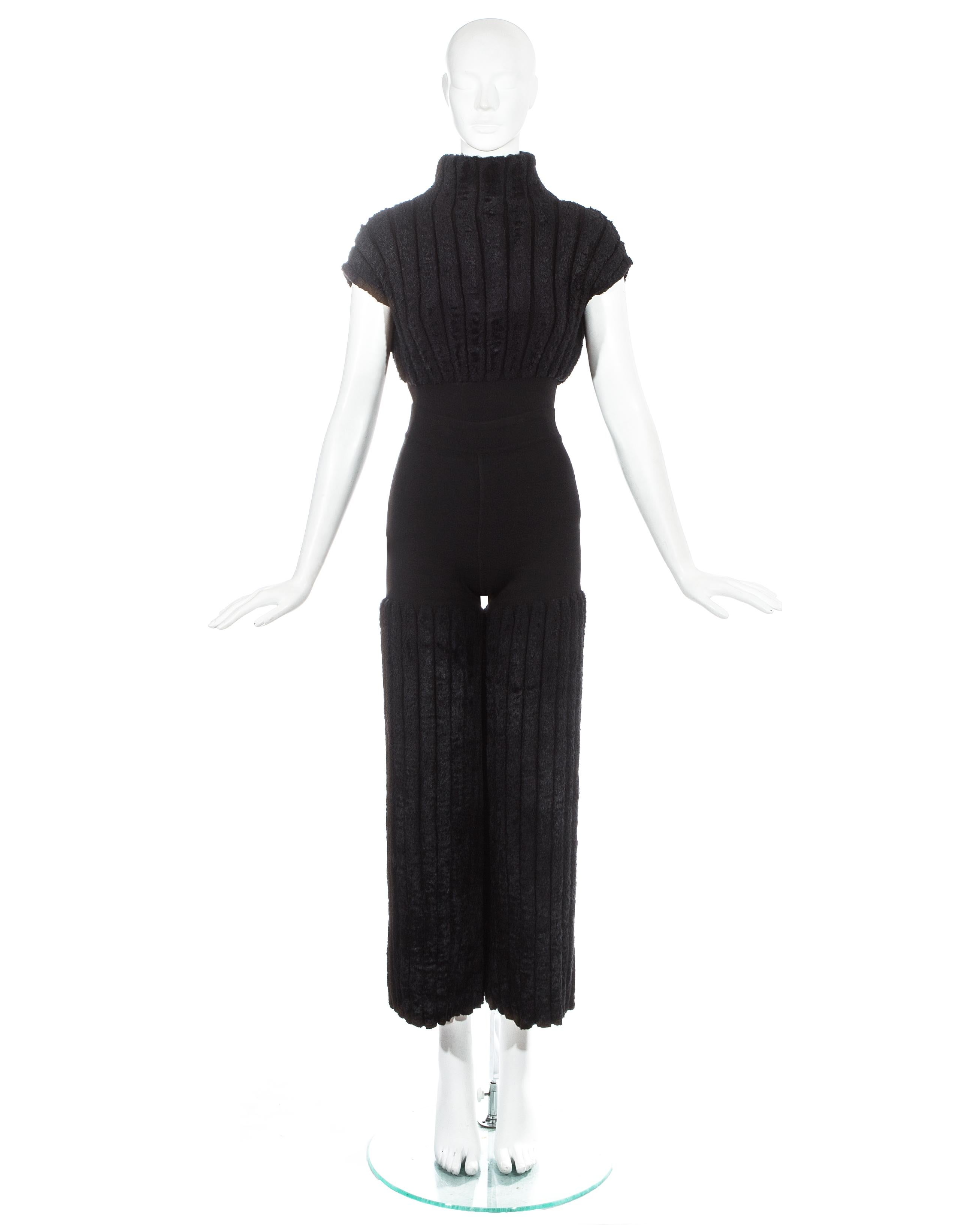 Azzedine Alaia, black chenille pant suit. Short sleeve cropped vest with turtle neck. High waisted flared pants. 

Spring-Summer 1994