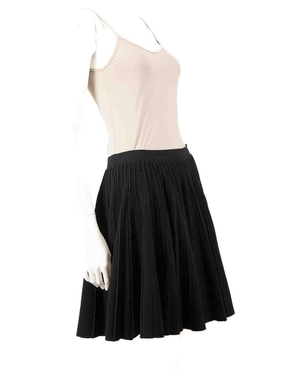 CONDITION is Very good. Minimal wear to skirt is evident. Minimal loose seam to rear internal waistband. Minimal pull thread to right side of waistband on this used Azzedine Alaïa designer resale item.
 
 
 
 Details
 
 
 Black
 
 Viscose
 
 Knit