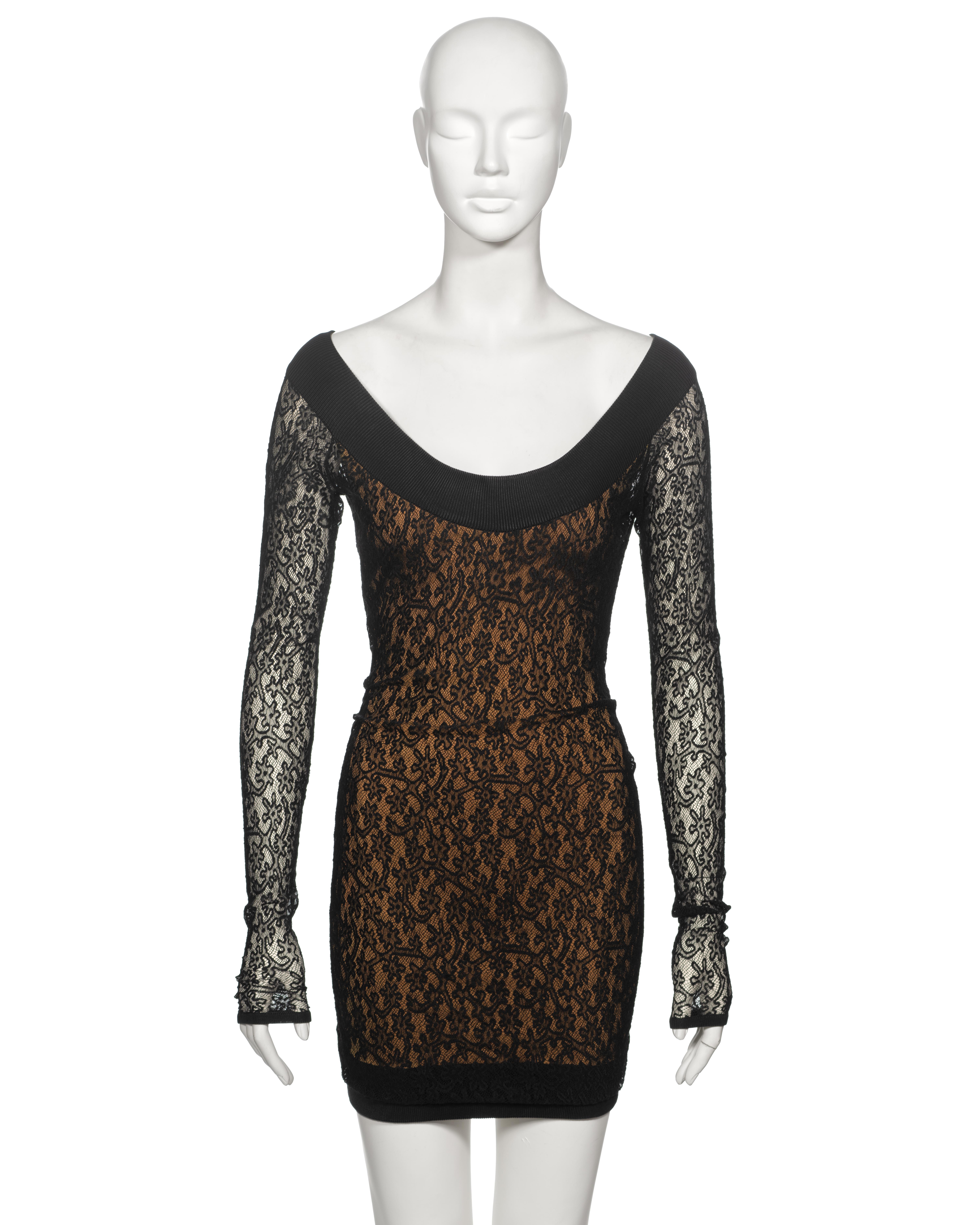 ▪ Archival Alaia Stretch Knit Lace Mini Dress
▪ Creative Director: Azzedine Alaia 
▪ Fall-Winter 1990 
▪ Sold by One of a Kind Archive
▪ Fashioned from black floral stretch knit lace
▪ Showcasing a wide ribbed knit off-shoulder neckline
▪ Unlined