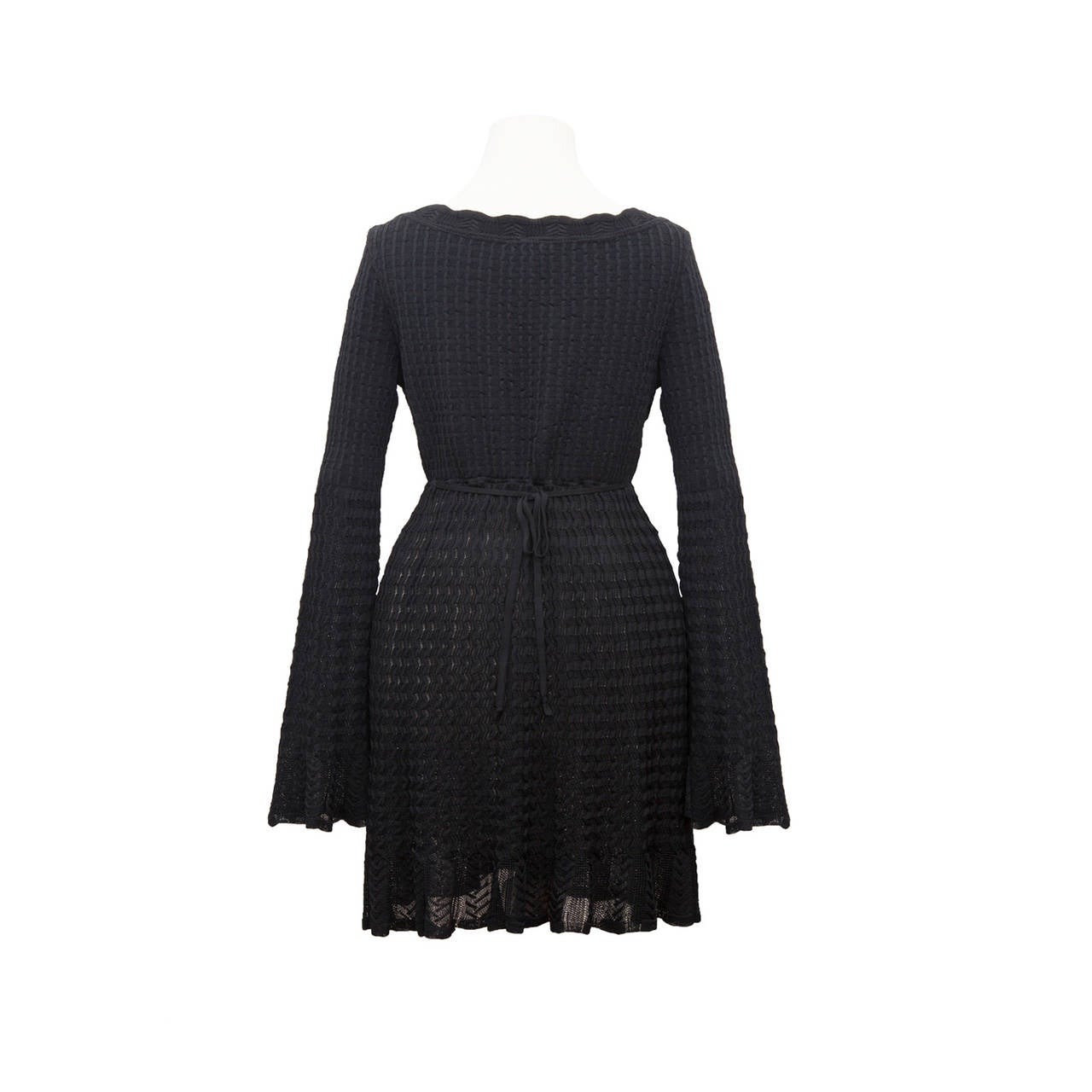 Alaia bell sleeve black knit dress with loose tie at the back. 
Made in Itay, 90% viscose, 6% nylon, 4% elastic
Size : M
Measurments : 
Shoulders - 37cm
waist: - 64 cm
sleeves - 65 cm
total length - 75cm
