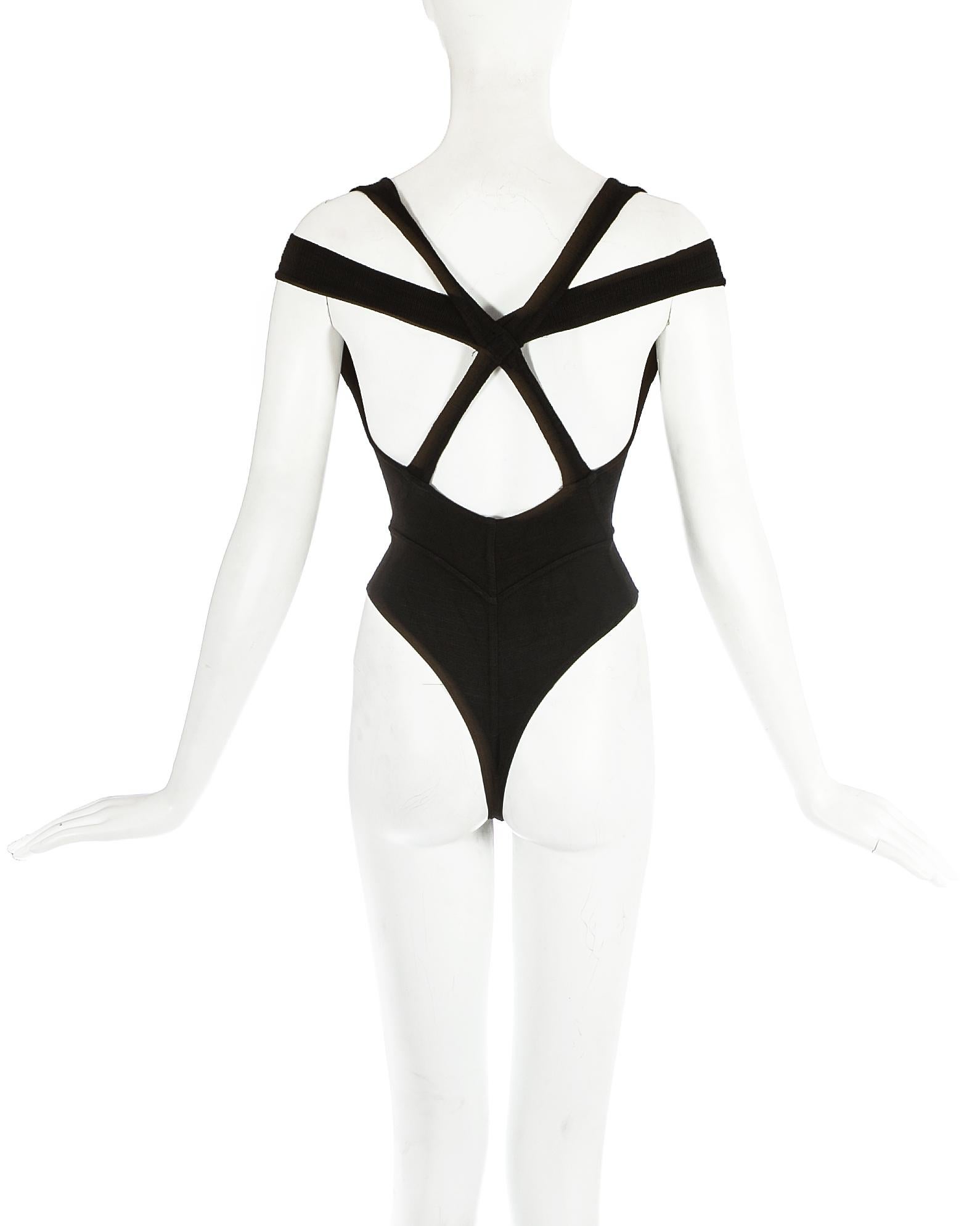 Azzedine Alaia; black knitted bodysuit with criss-cross shoulder straps. 

Spring-Summer 1991