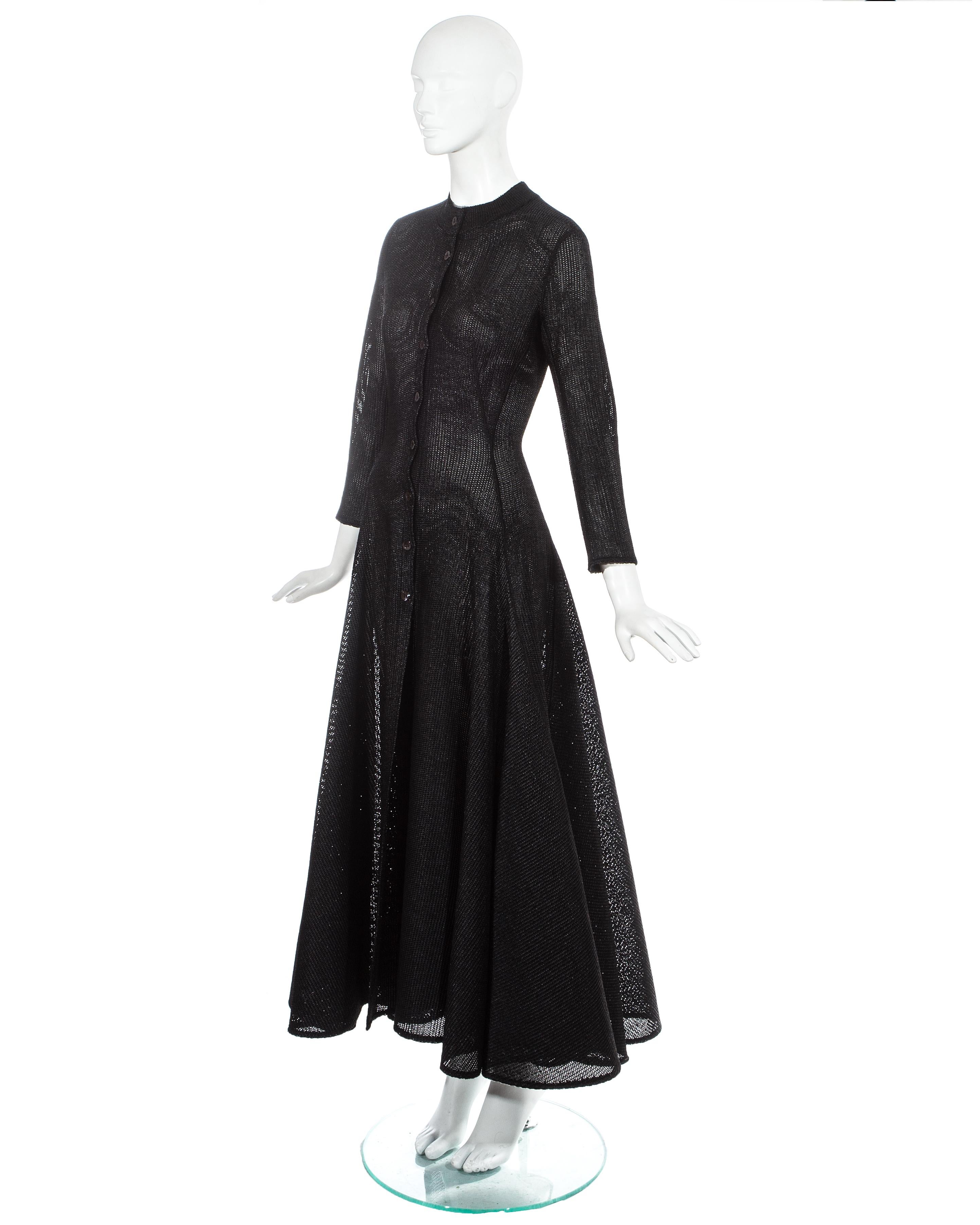 Azzedine Alaia; black knitted viscose raffia evening dress. Full structured skirt, button up fastenings and fitted sleeves. 

ca. 1996